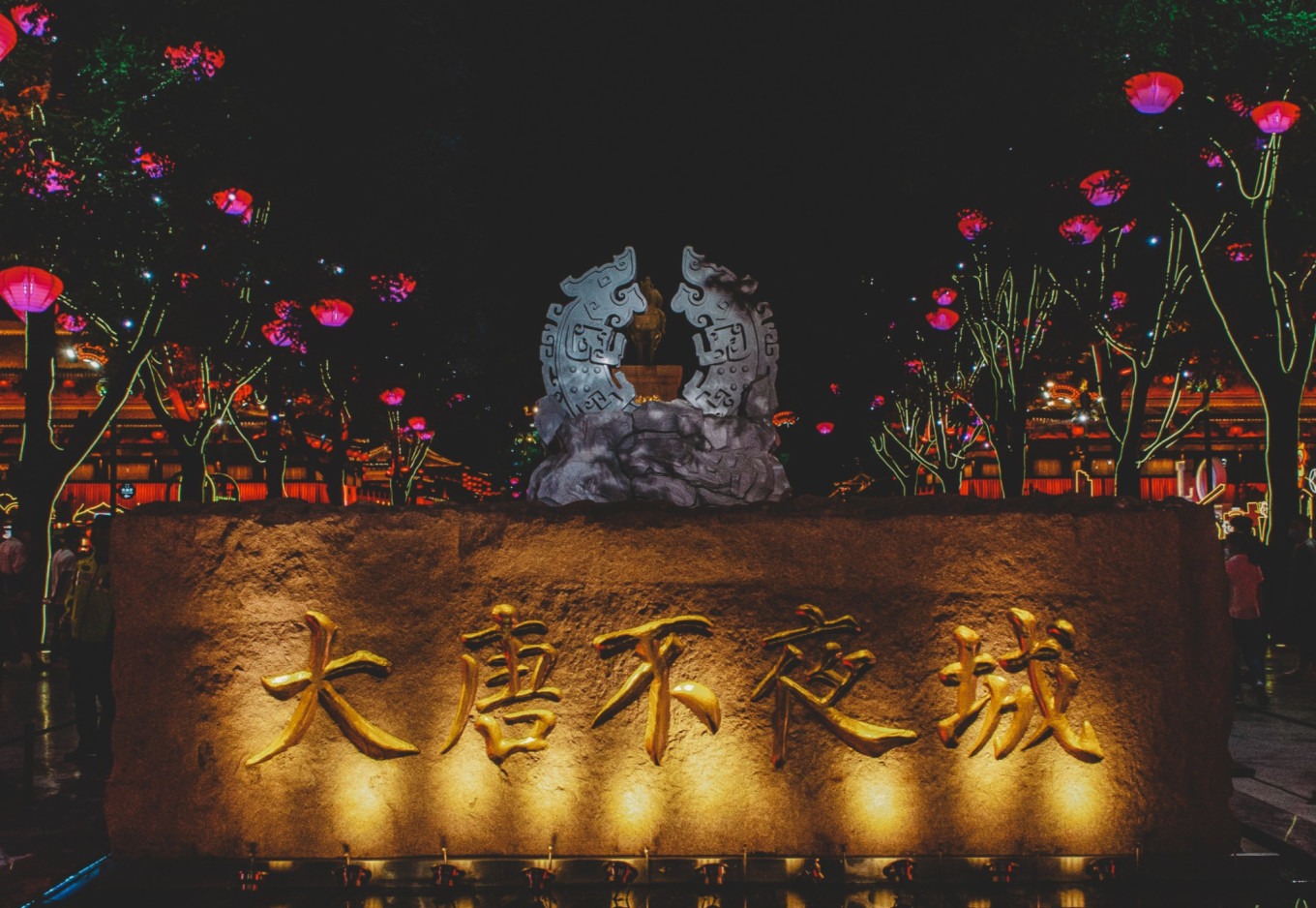 Night view of Tang Paradise with illuminated Tang-style buildings and lanterns