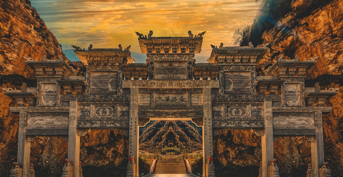 Ancient gate of Mount Huashan with red walls and golden tiles