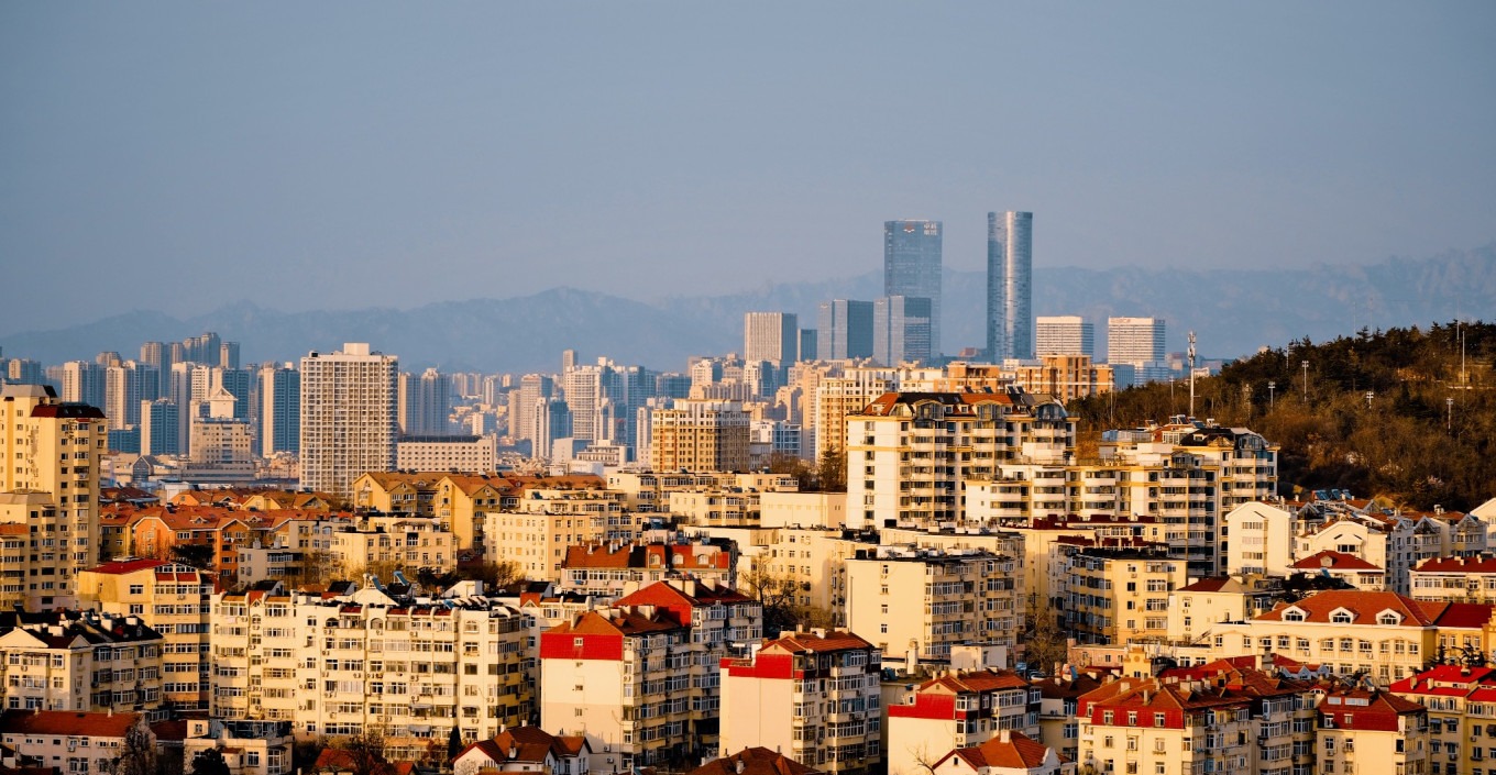 Sunset with red and orange hues over Qingdao's skyline