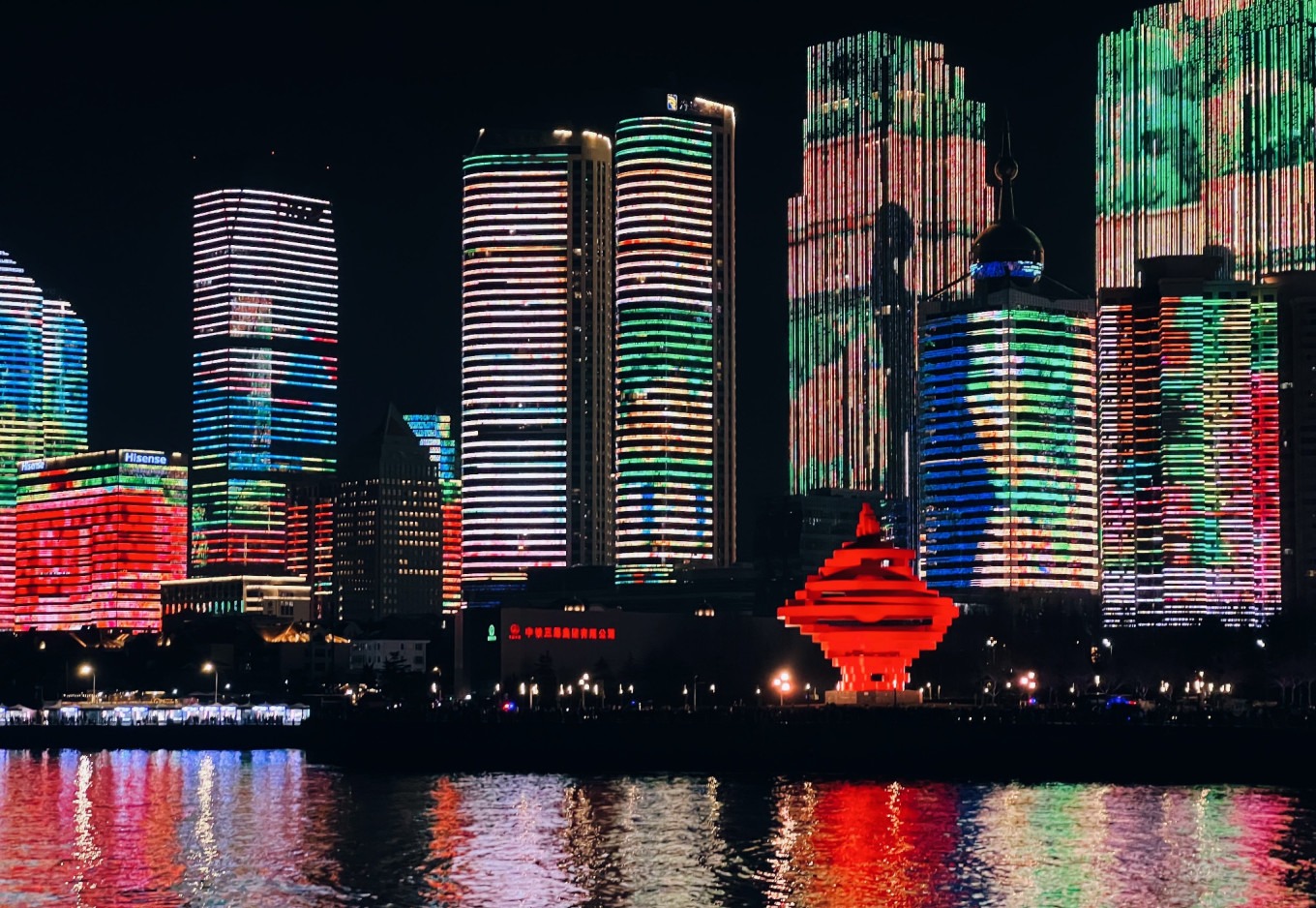 Vibrant night market with colorful lights in Qingdao