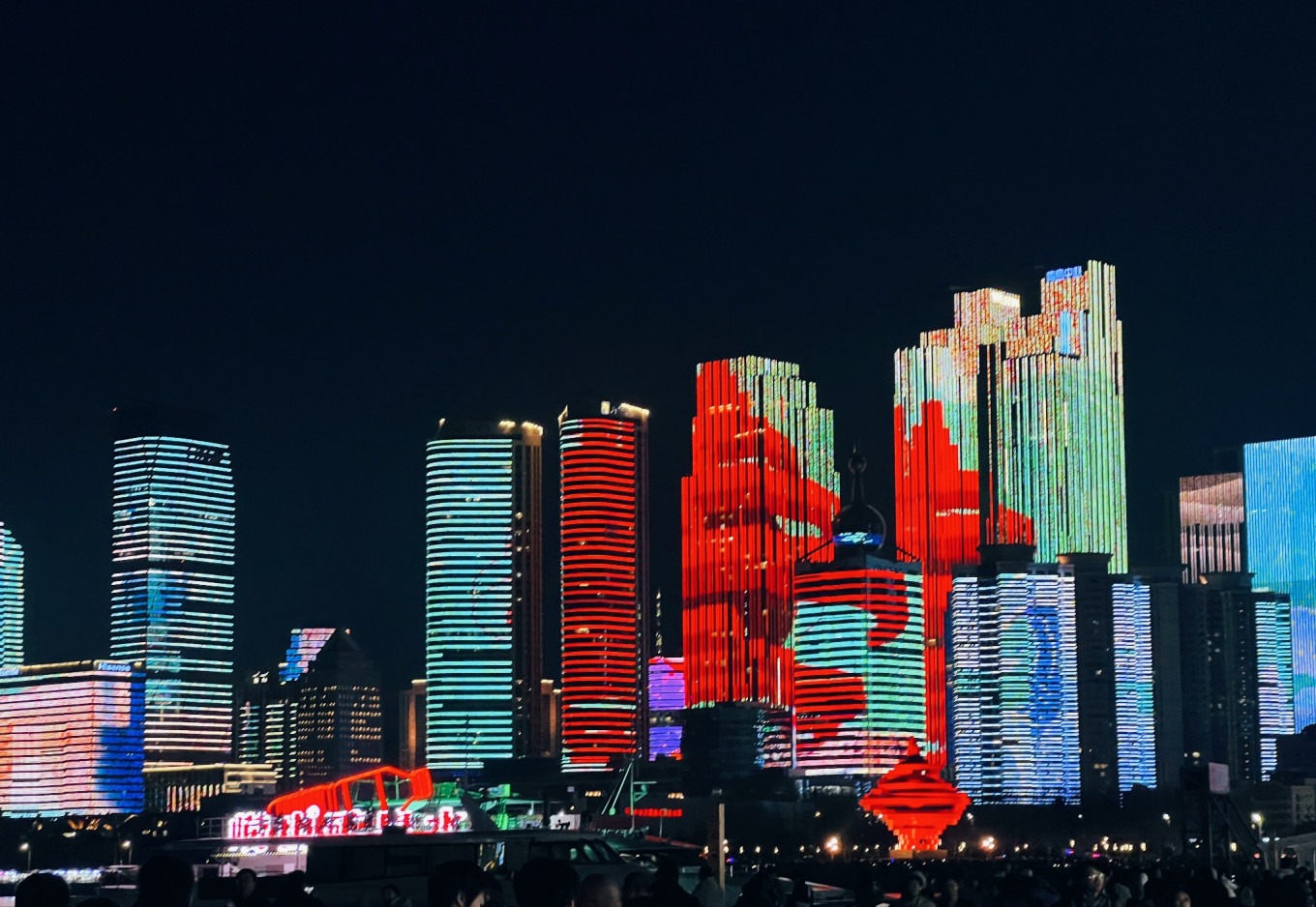 Night view of May Fourth Square with the iconic May Wind sculpture lit up