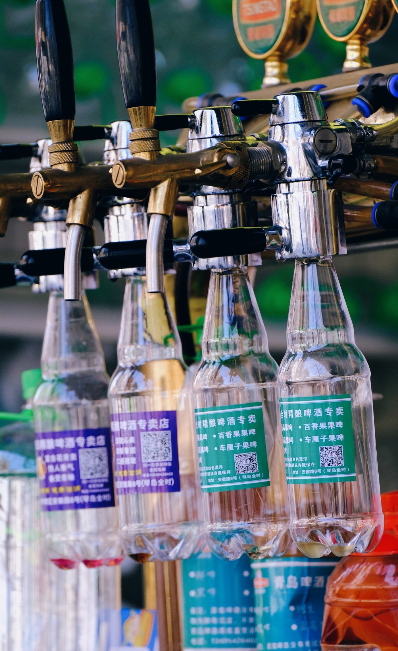 Cold fruit beer and draft beer at a Qingdao street stall