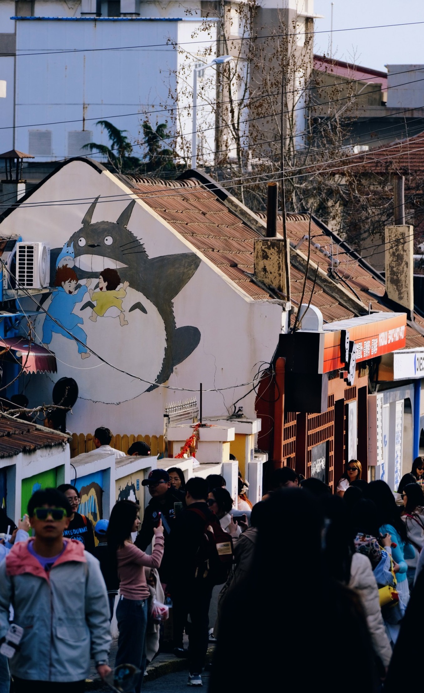 Mural of characters from Spirited Away on a building wall