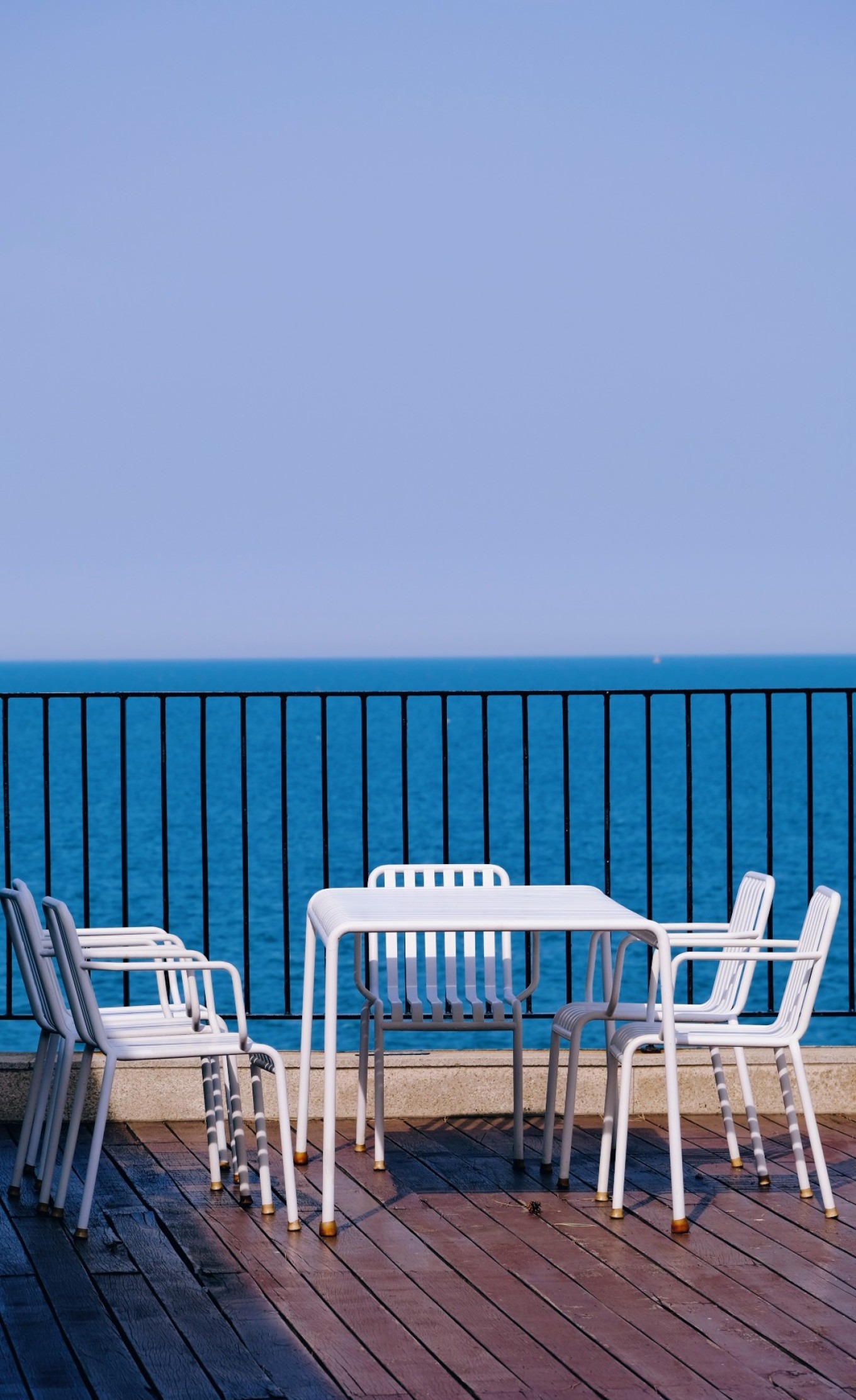 Cup of coffee on a table overlooking the sea