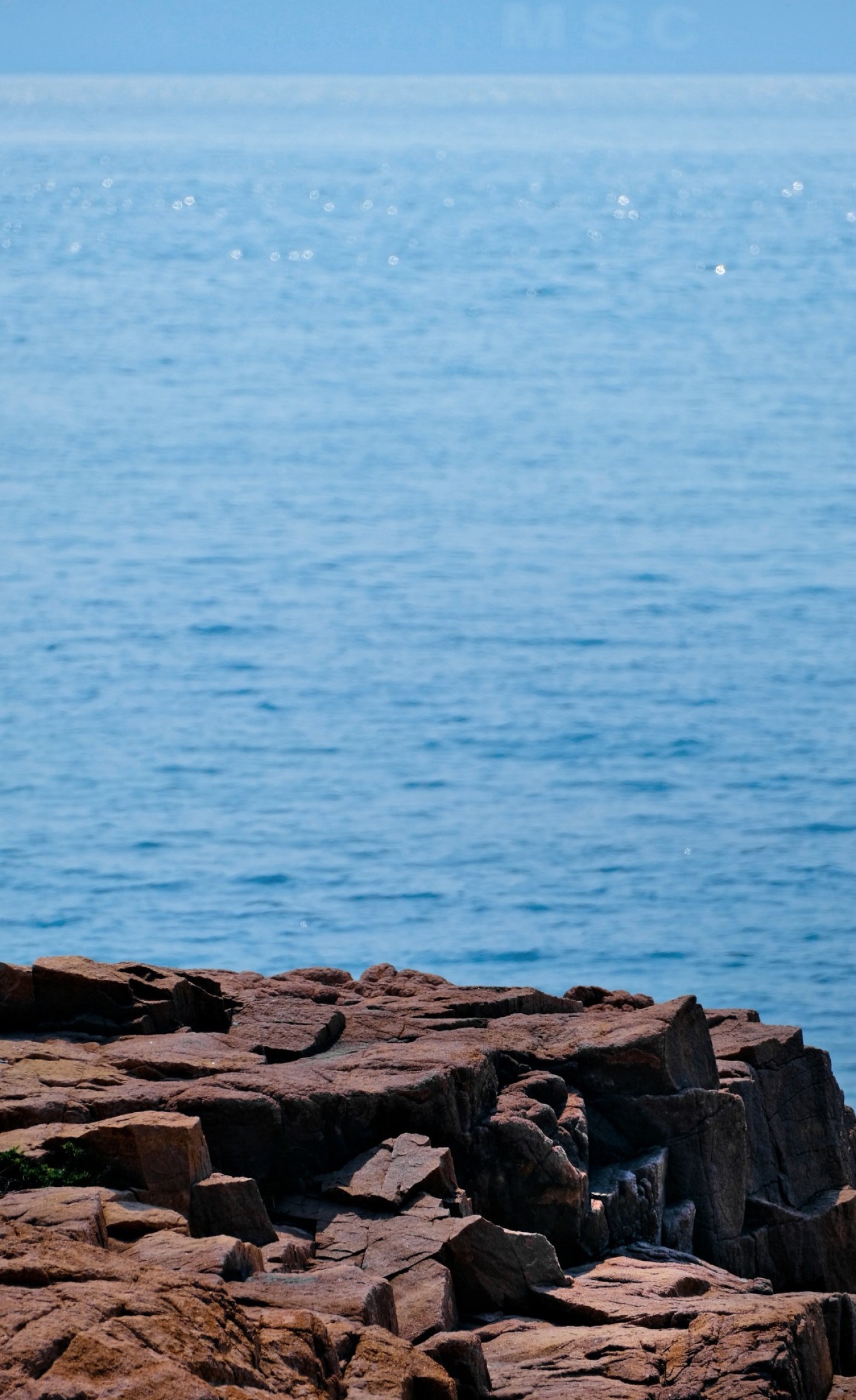 Coastal walkway at Taipingjiao with views of the sea and greenery
