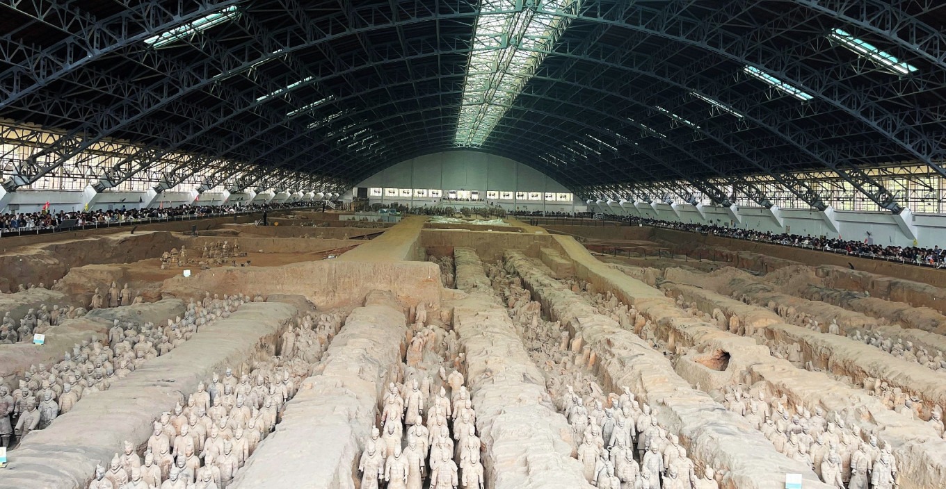Visitors looking down into the excavated pit of Terracotta Warriors