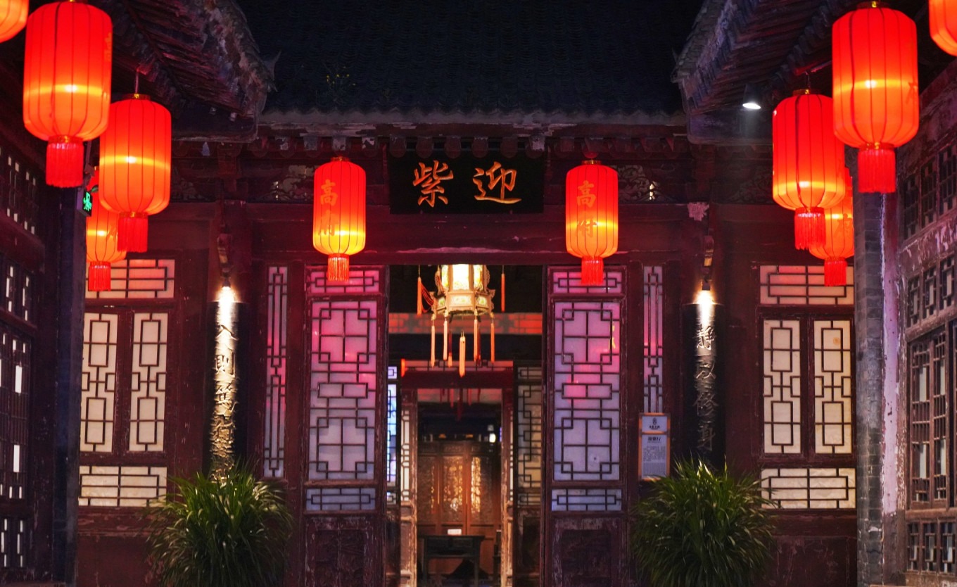 Interior courtyard of Gao's Grand Courtyard with intricate wood carvings