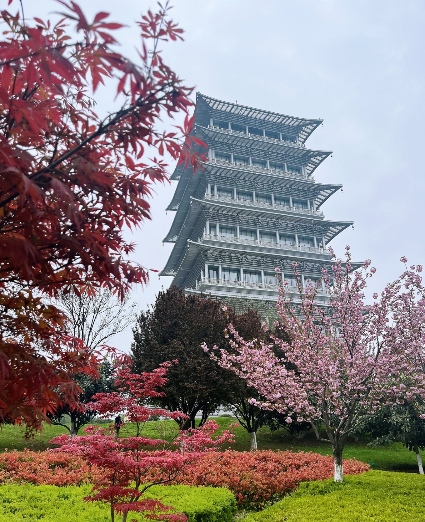 Chang'an Pagoda surrounded by vibrant flowers in Xi'an Expo Park