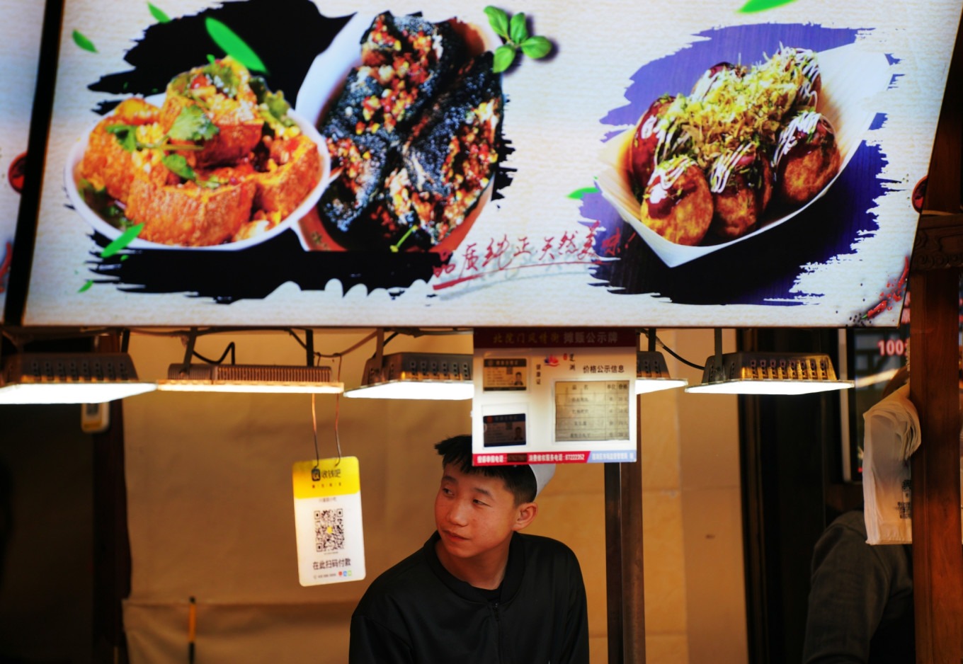 Close-up of grilled skewers and snacks at Muslim Quarter