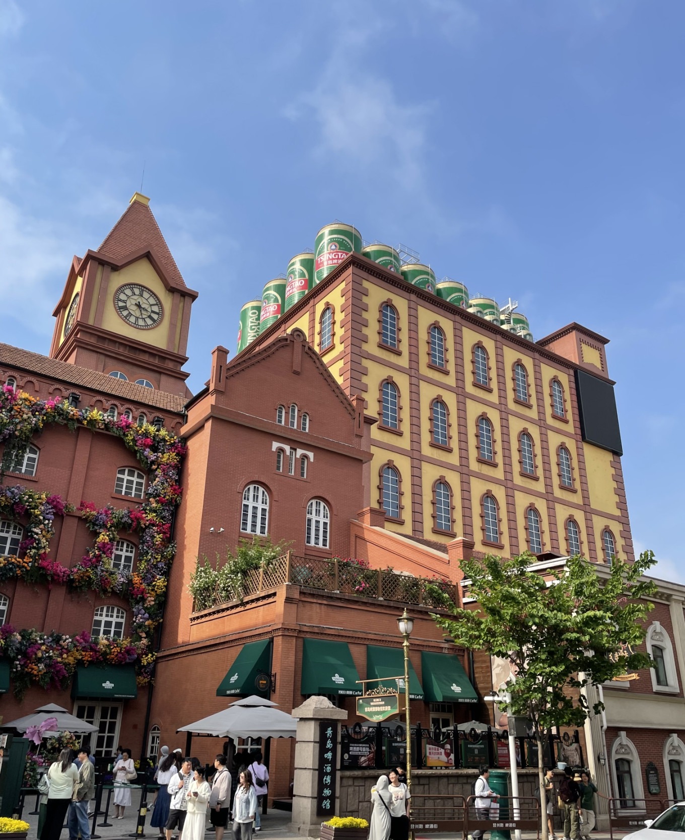 Entrance of Tsingtao Beer Museum with beer barrels and signage