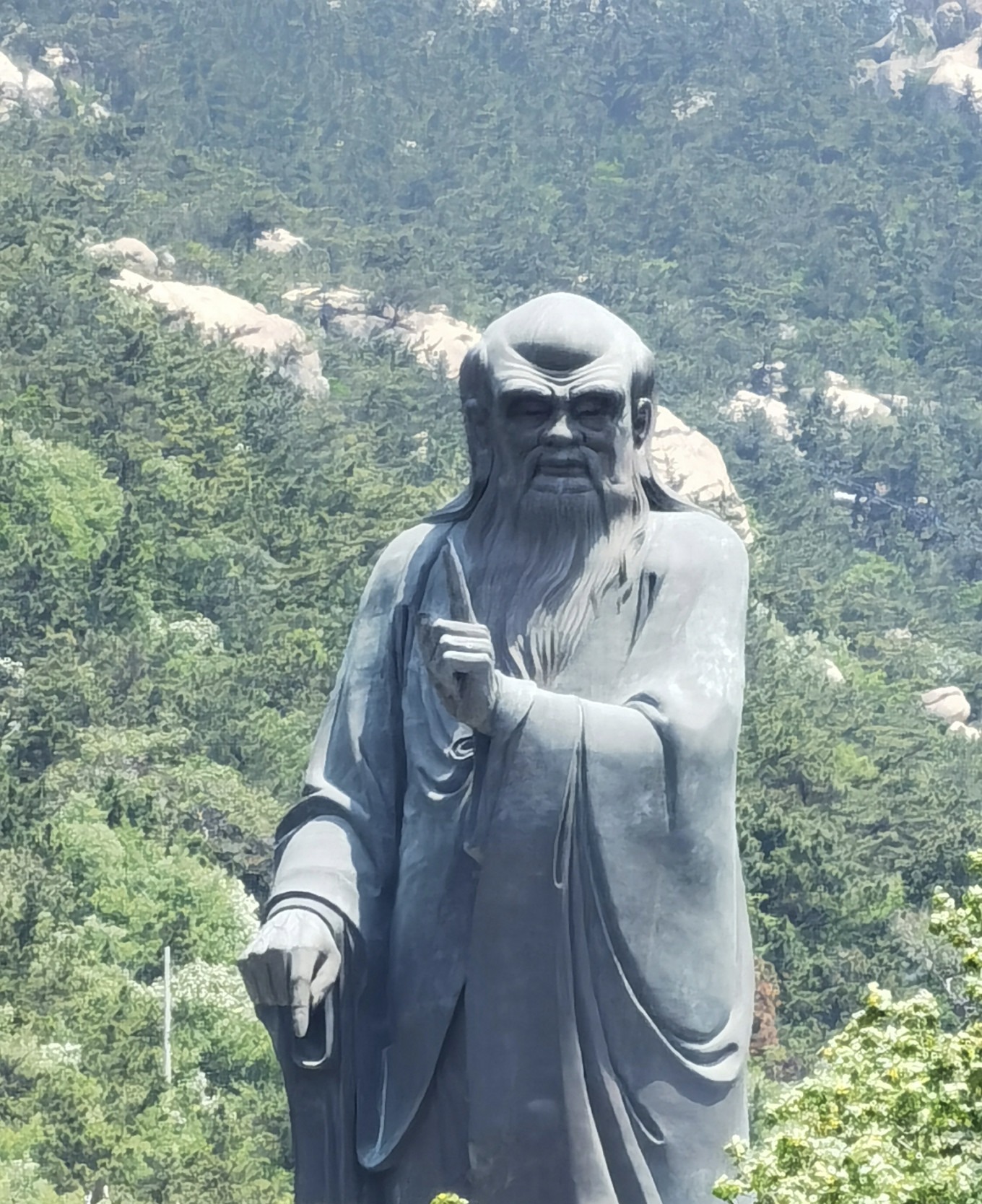 Bronze statue of Laozi at Taiqing Palace with distinctive hand gesture