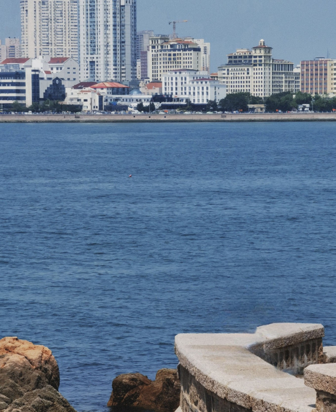 Pathway on Little Qingdao Island with sea views