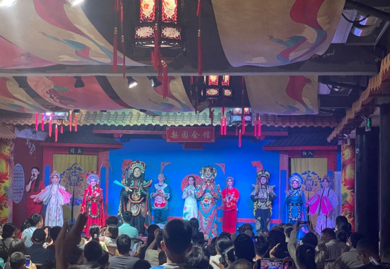 Sichuan opera face-changing performer on stage at Liyuan Guild Hall