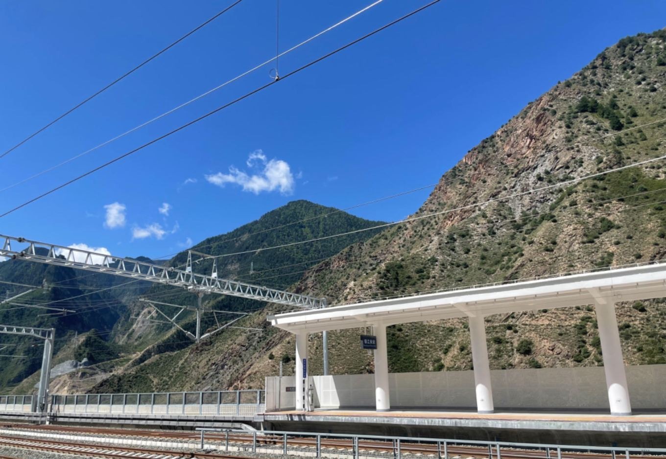 Zhenjiangguan small station with blue sky and mountains