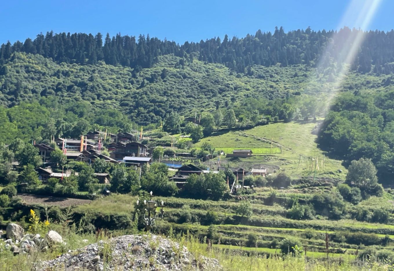 Horseback riding trail in Zhongcha Valley with a Tibetan village in the background