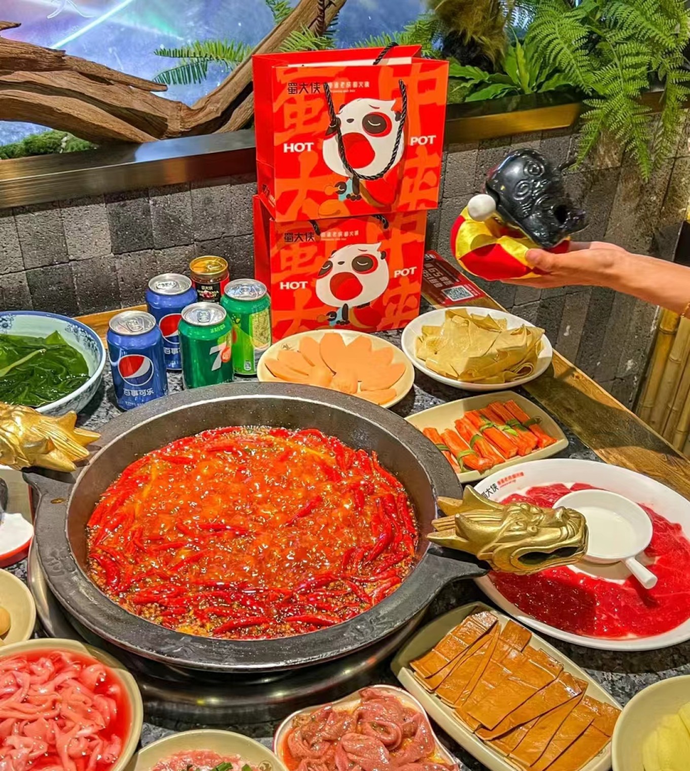 Spicy hot pot bubbling with chilies and spices at Shu Daxia restaurant