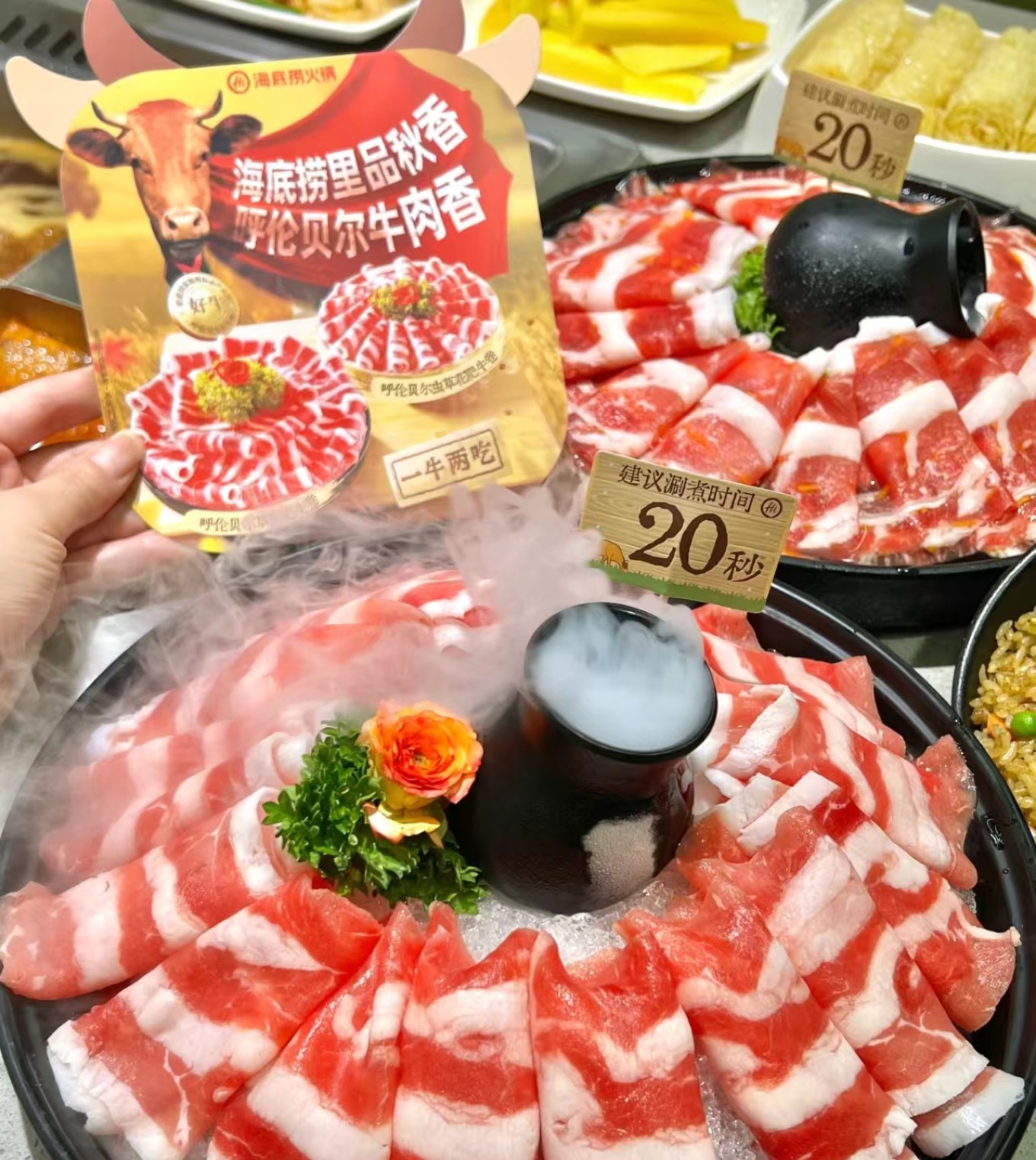 Diners enjoying hot pot with attentive service at Haidilao