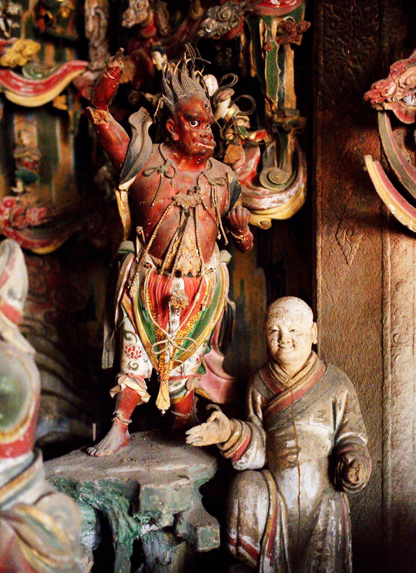 Yaksha statue beside Guanyin