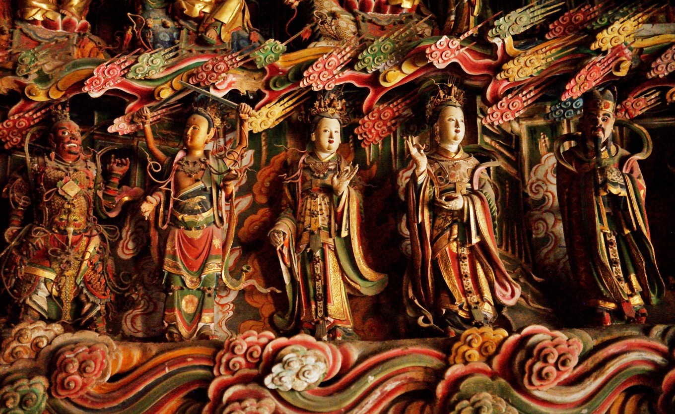 Close-up of various Deva statues showing different expressions