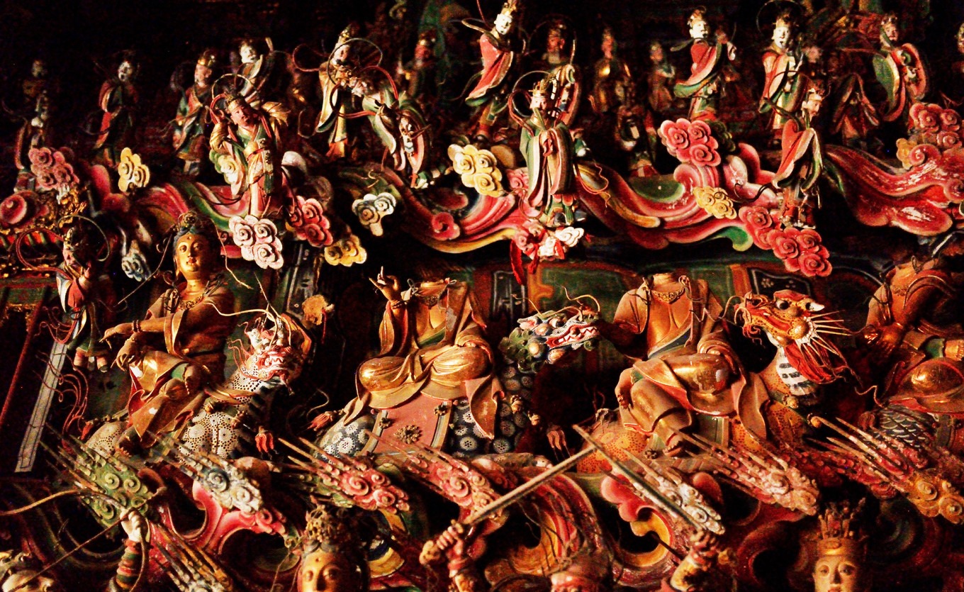 Headless bodhisattva statues among the Twelve Perfections on north wall