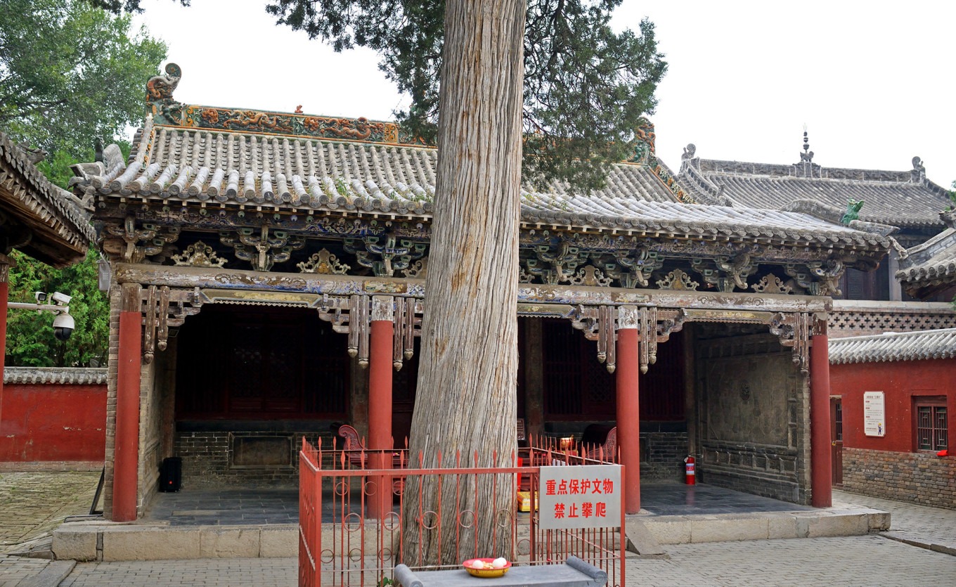 Golden plaque reading Guanyin Hall above the main hall entrance