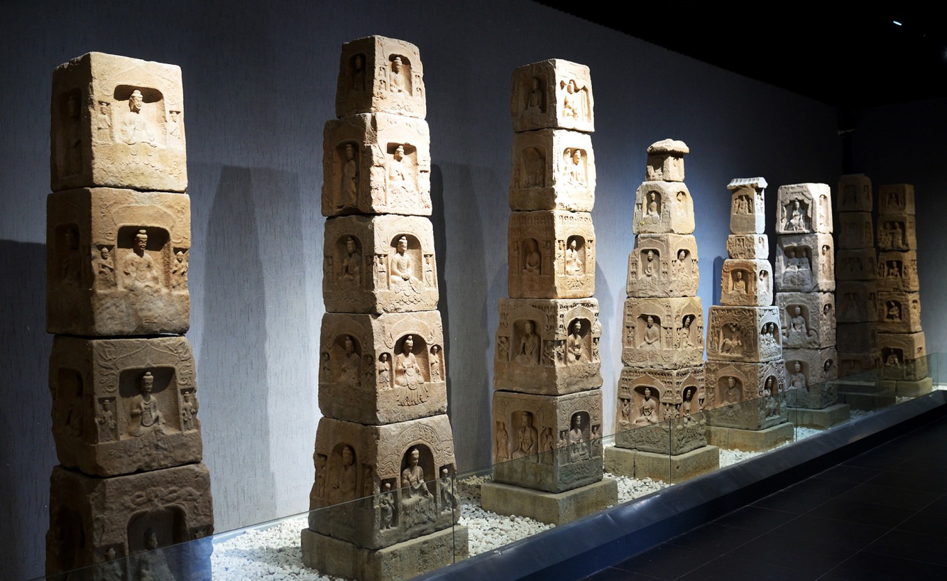 Stacked pagoda niche blocks forming a miniature stone pagoda