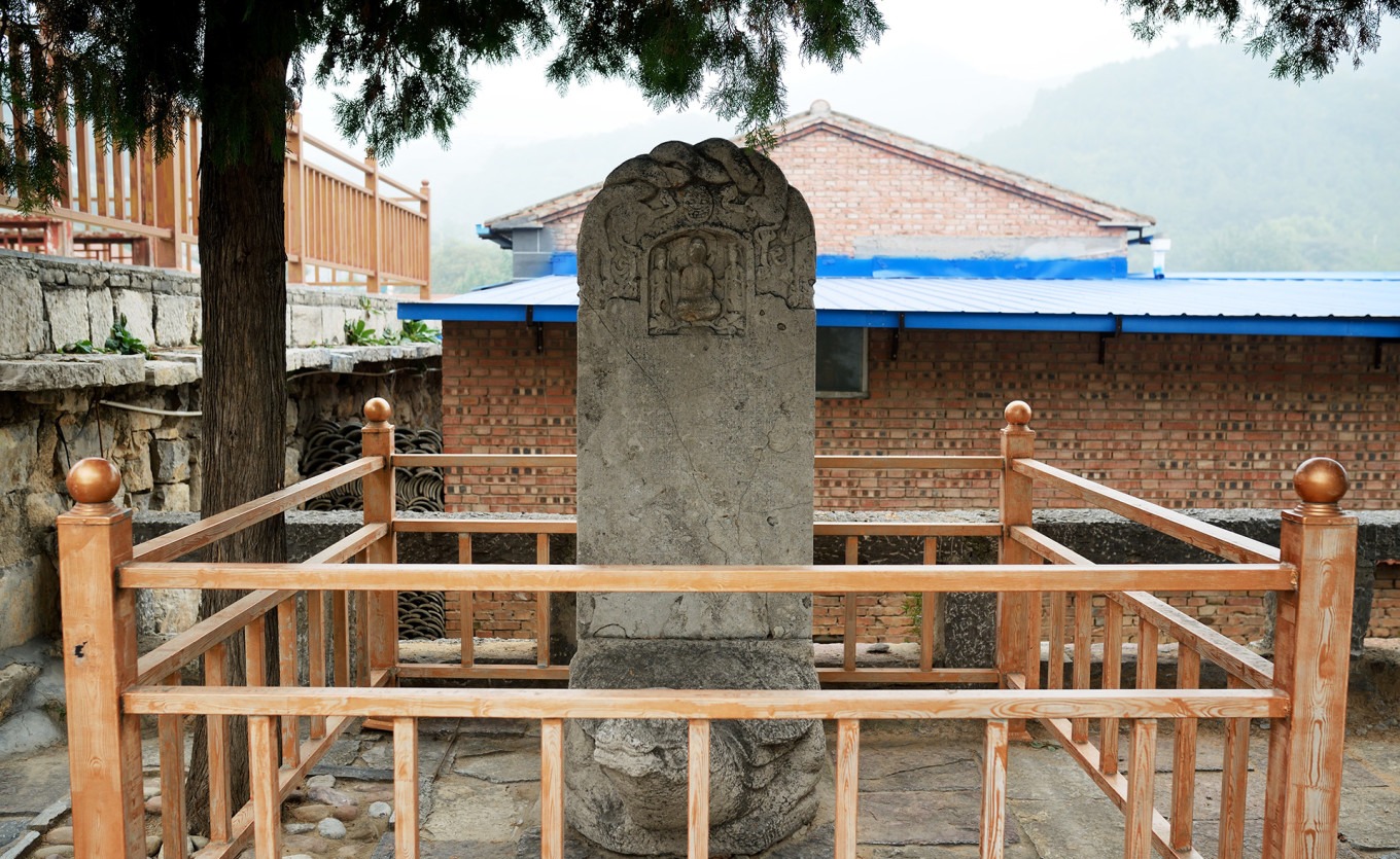 Ancient stele with Buddha carvings at Tiantai Temple
