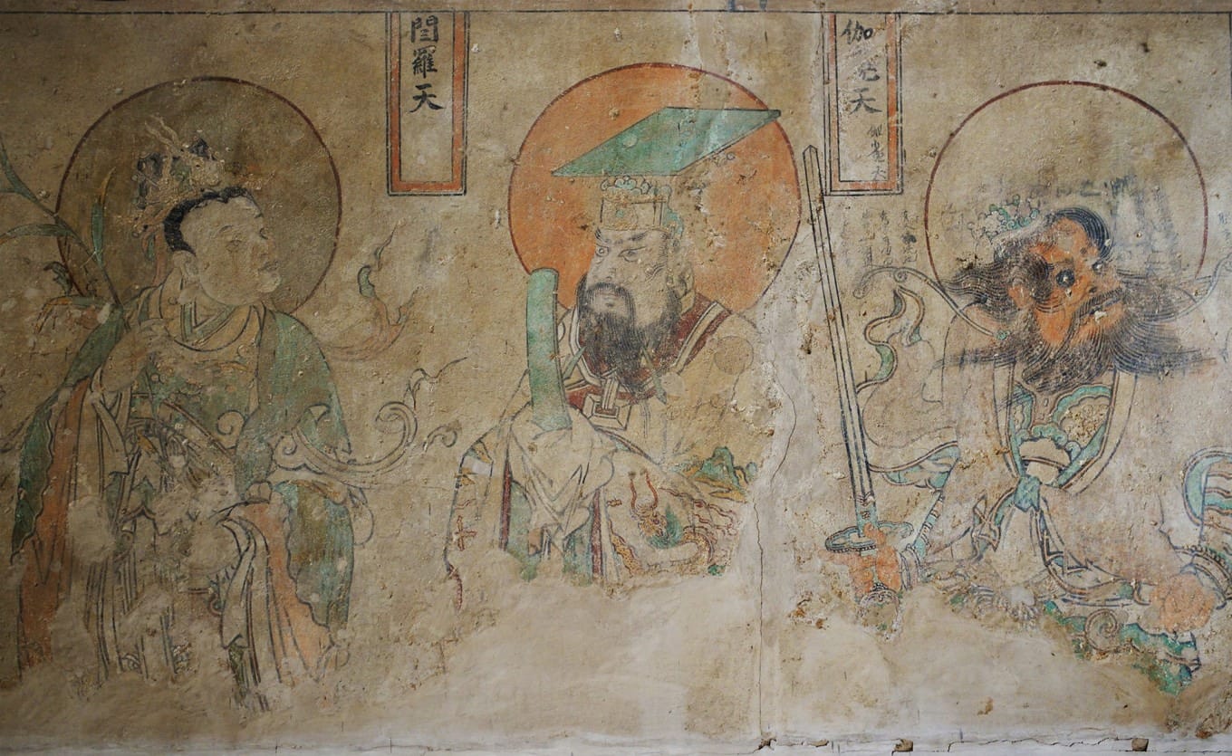 Close-up of a deva figure in the mural