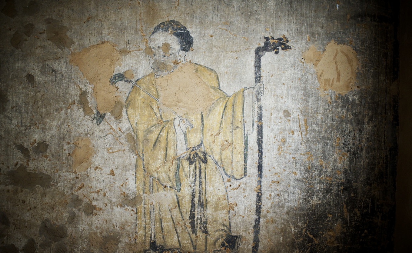 Another view of the legend mural with figures and text