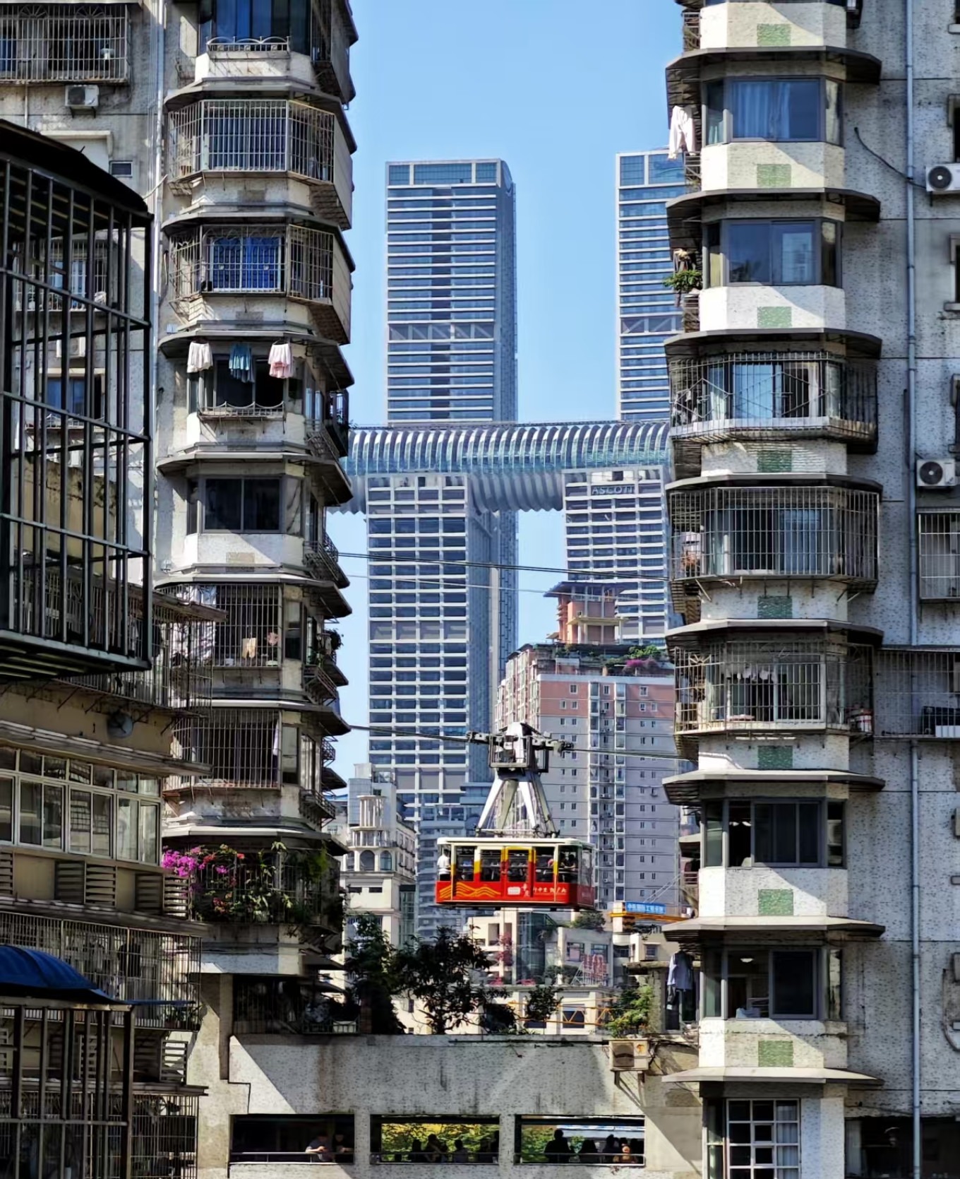 Yangtze River Cableway car crossing the river with Yuzhong Peninsula skyline in background