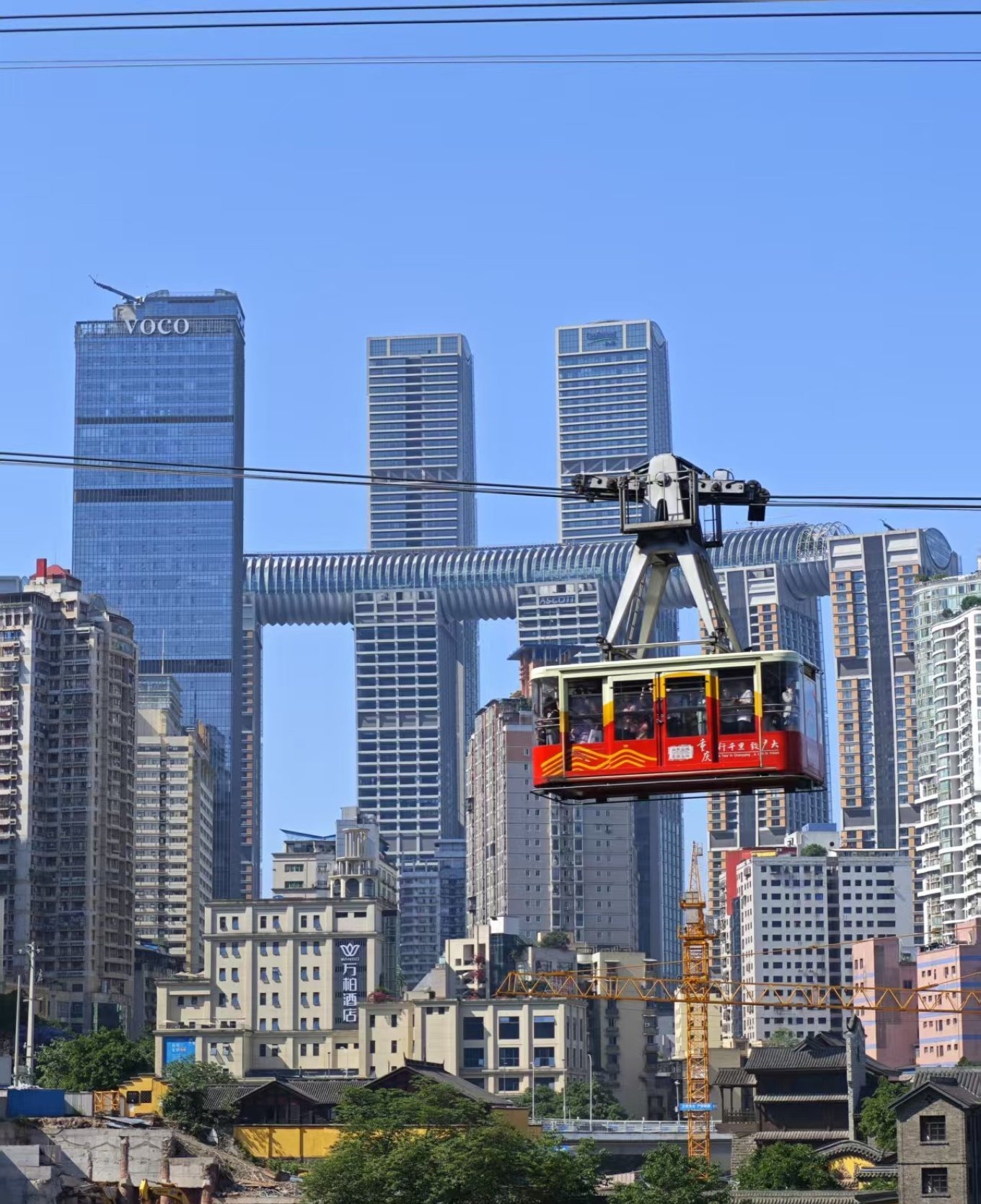 View from inside the cableway car showing the Yangtze River and city skyline
