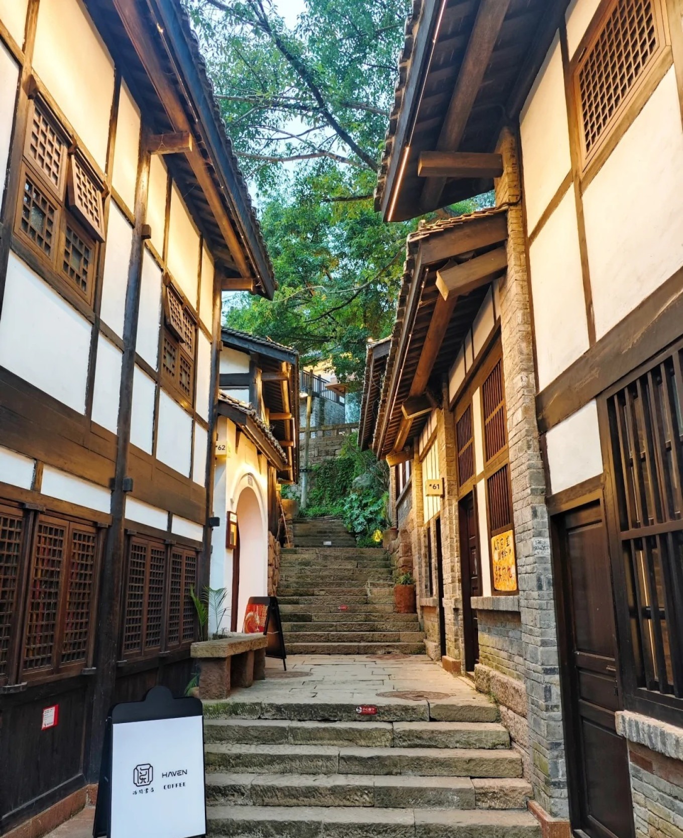 Art exhibition and tea house along Xiahao Old Street with stone steps and greenery