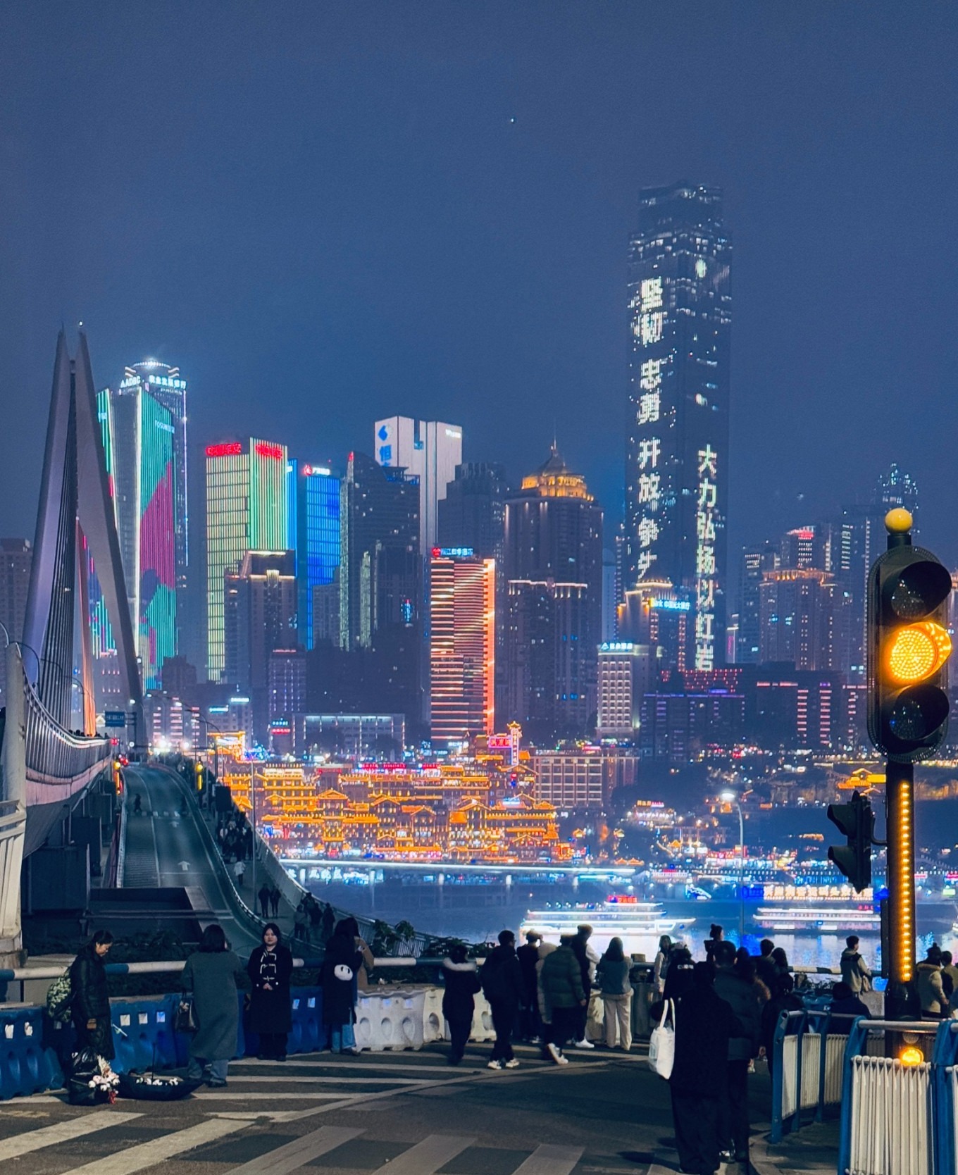 View of Hongya Cave from Qiansimen Bridge at dusk