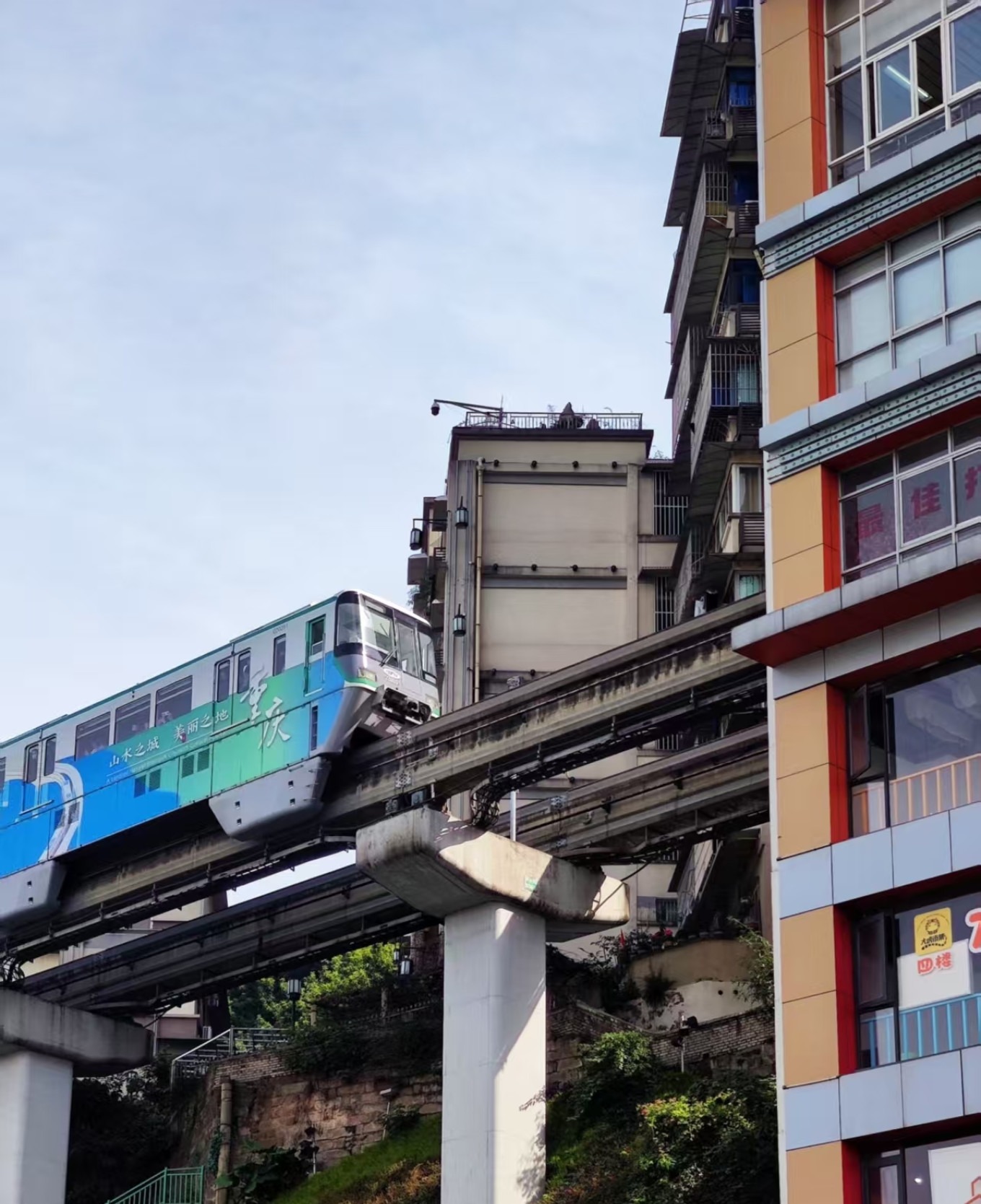 Monorail passing through a residential building at Liziba station in Chongqing