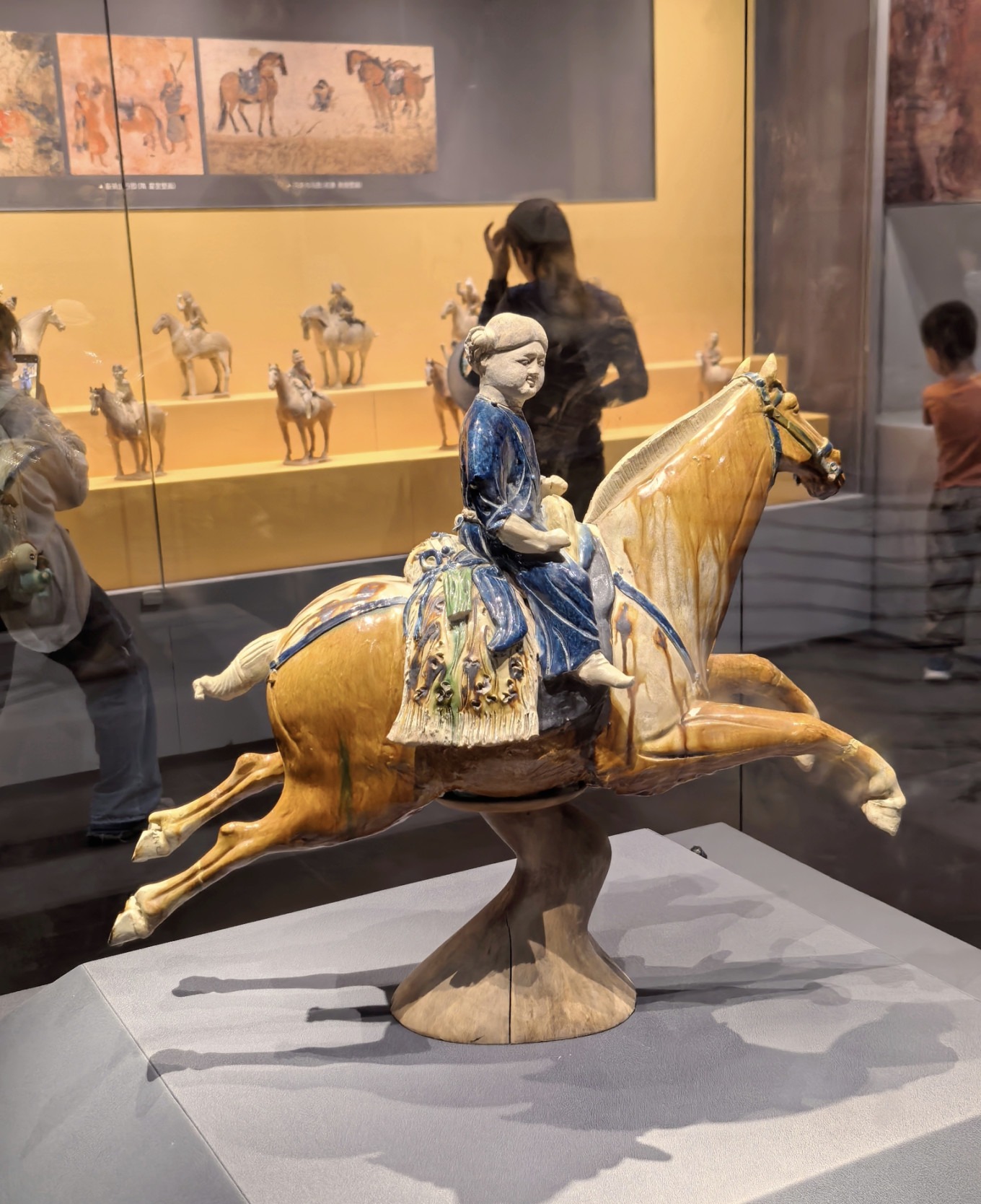 Tri-color glazed pottery horse with blue robe rider
