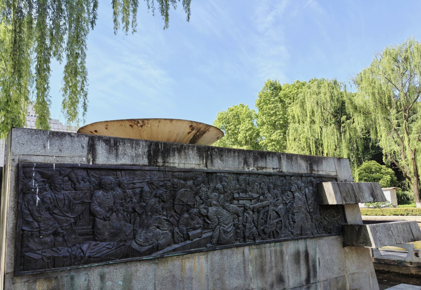Relief sculpture on campus wall at Xi'an Jiaotong University