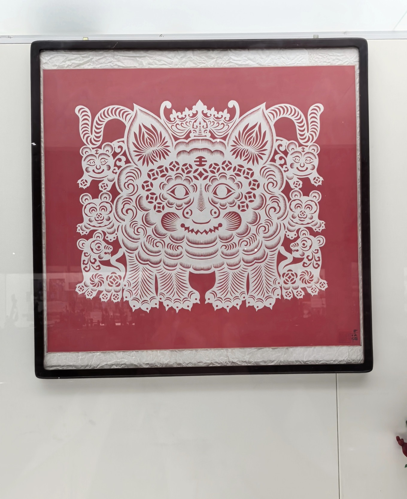 Paper-cutting artwork of tigers, both small and large