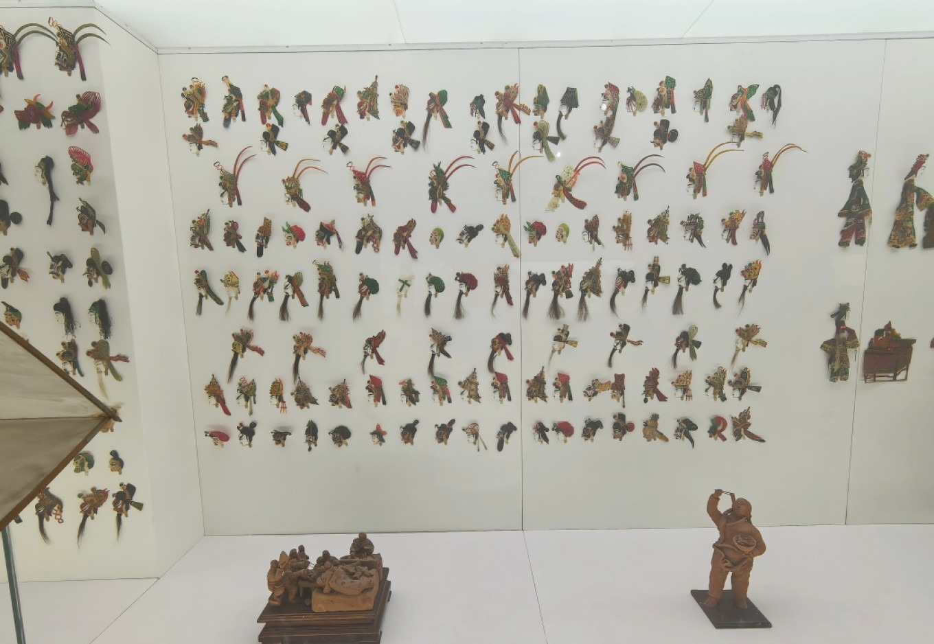 Shadow puppet exhibit showing traditional figures