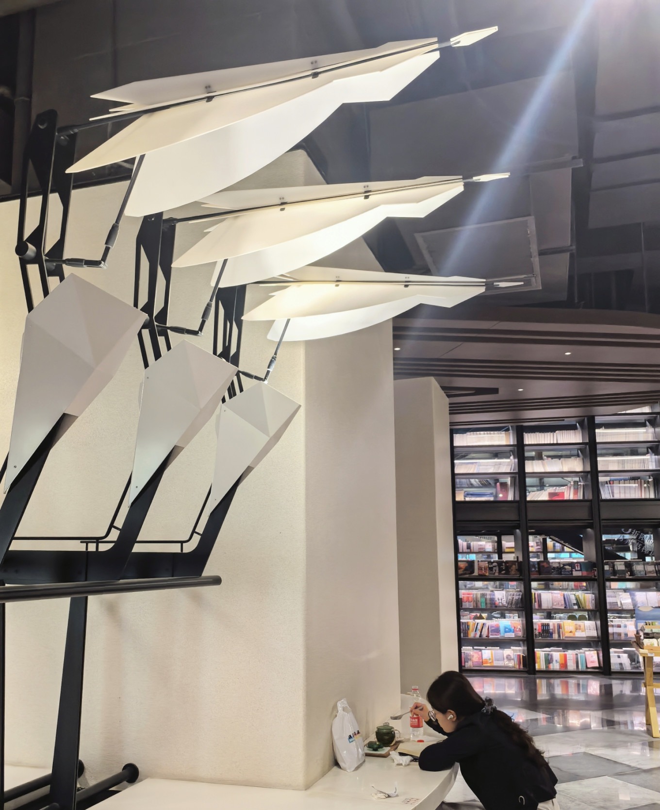 A visitor reading in the beautiful bookstore, captured in a candid moment
