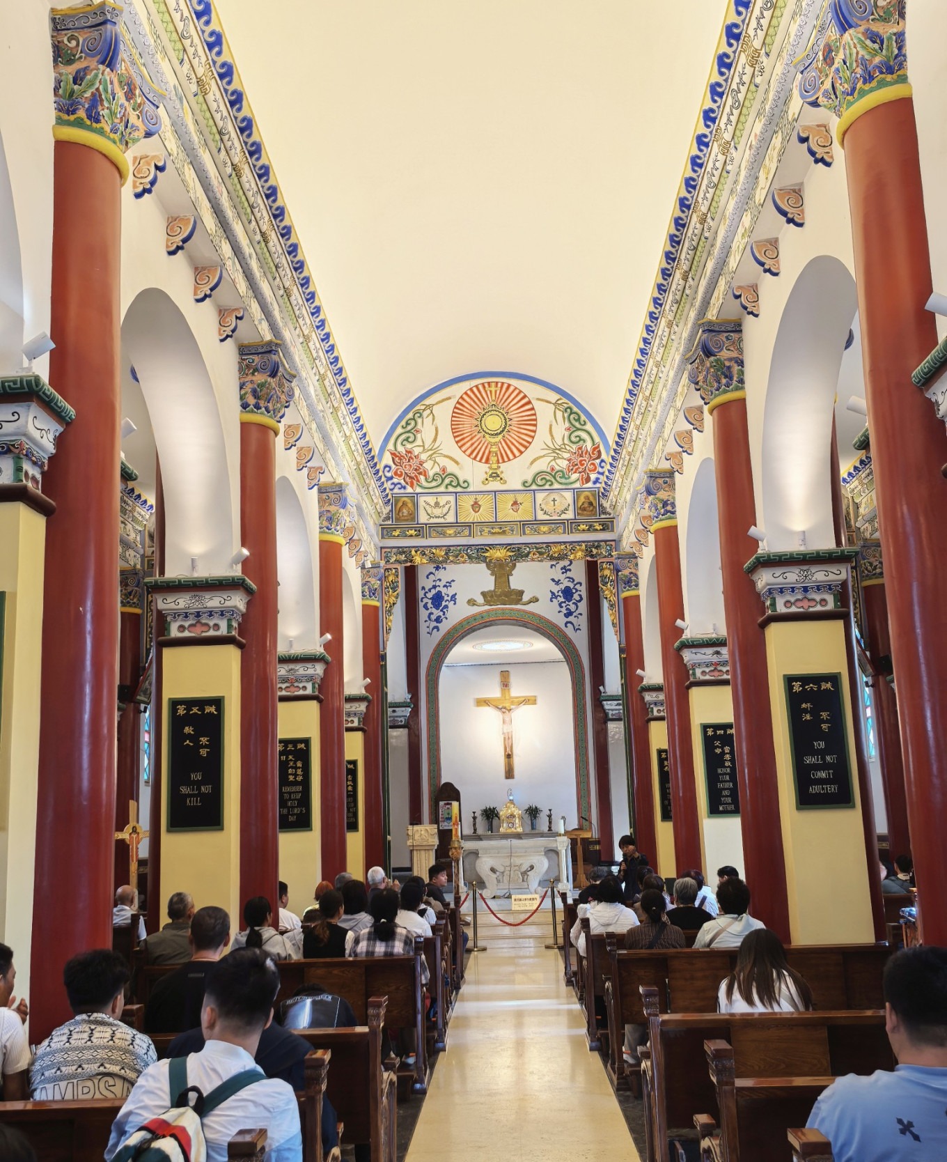 Wide shot of the church interior with visitors