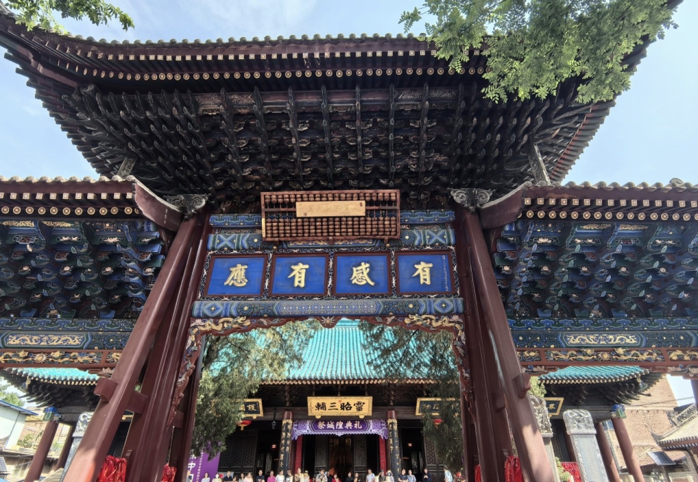 Sign reading 'Man's calculations are no match for Heaven's' at Xi'an City God Temple