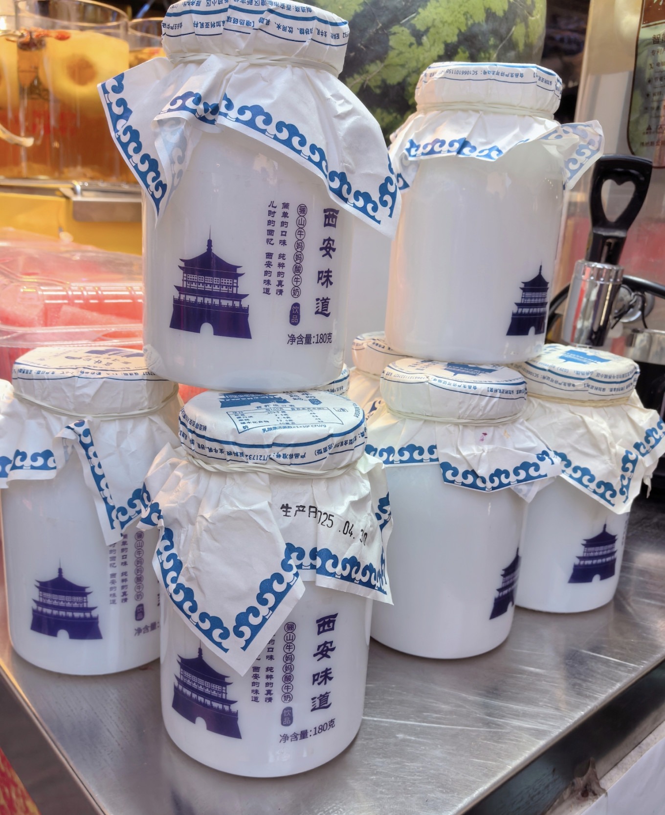 Food stall with price signs showing 10 yuan for Xi'an Flavor