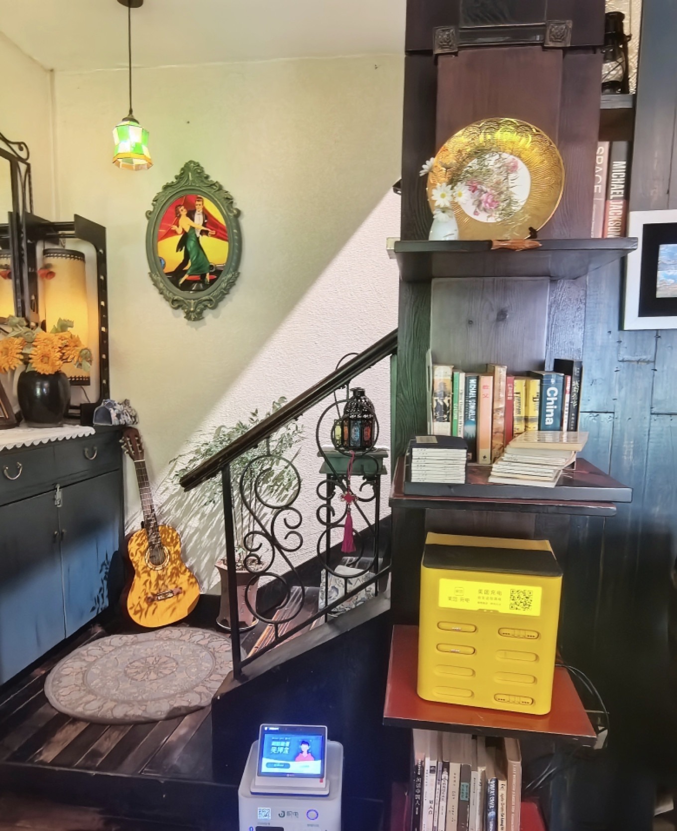 A cozy corner in a Defu Lane café with books and plants