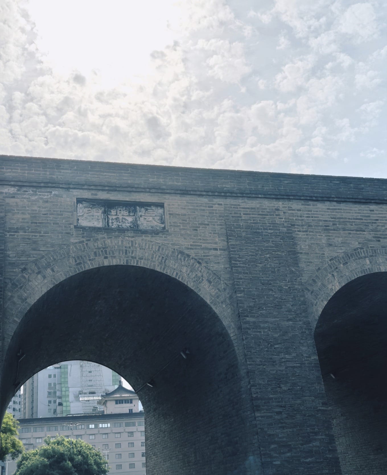 Contrast between inside and outside the city gate, old and new