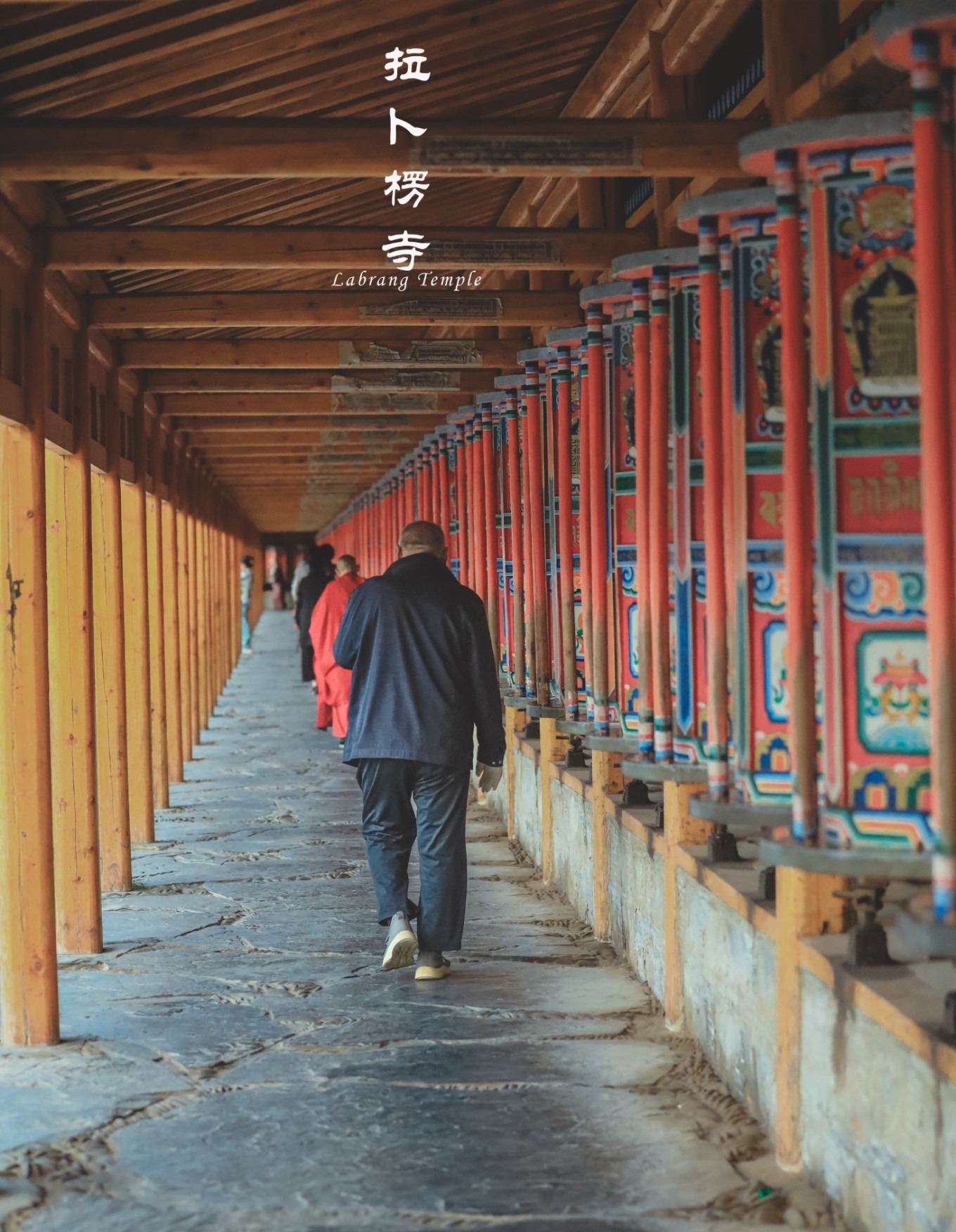 Close-up of prayer wheels along the long corridor at Labrang Monastery