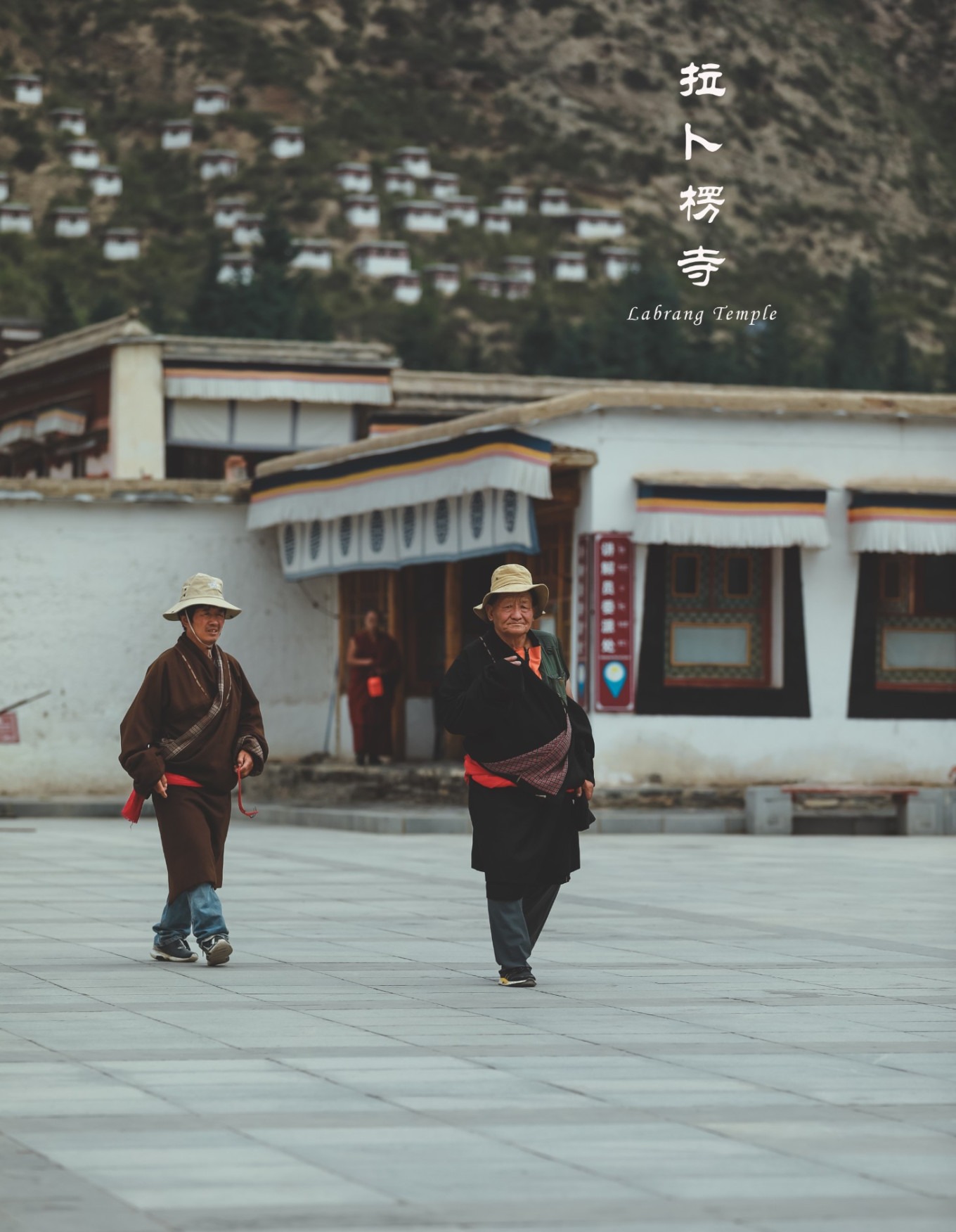 Pilgrims walking toward the main assembly hall at dawn