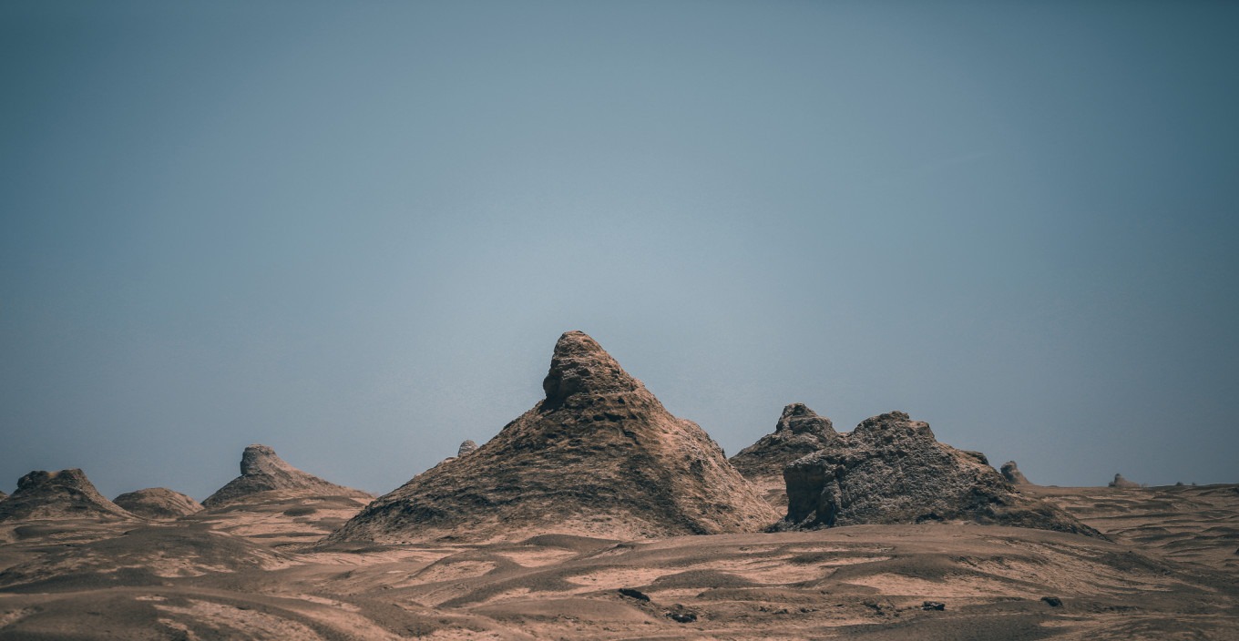 Panoramic view of Yadan mounds under harsh sunlight