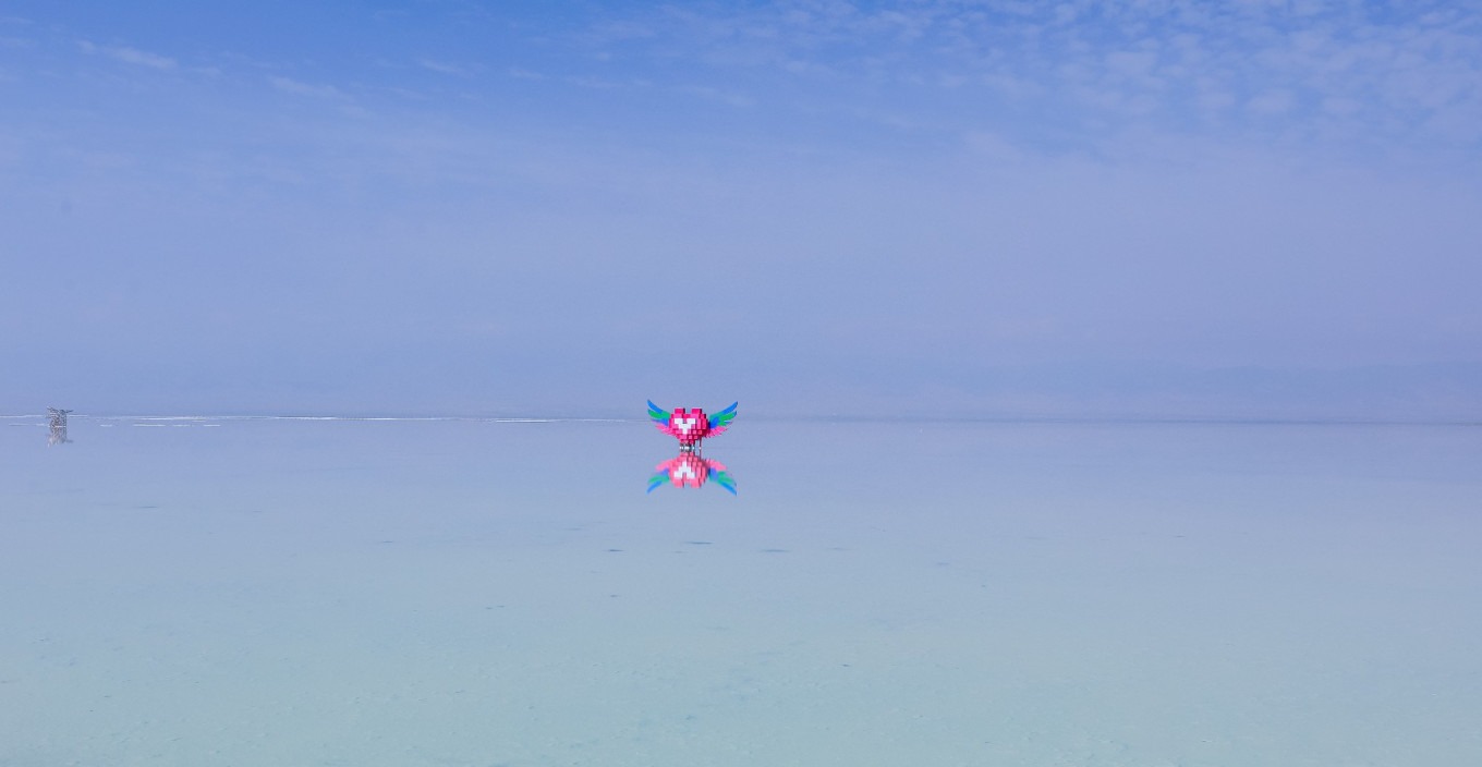 Salt lake surface with mountain reflection