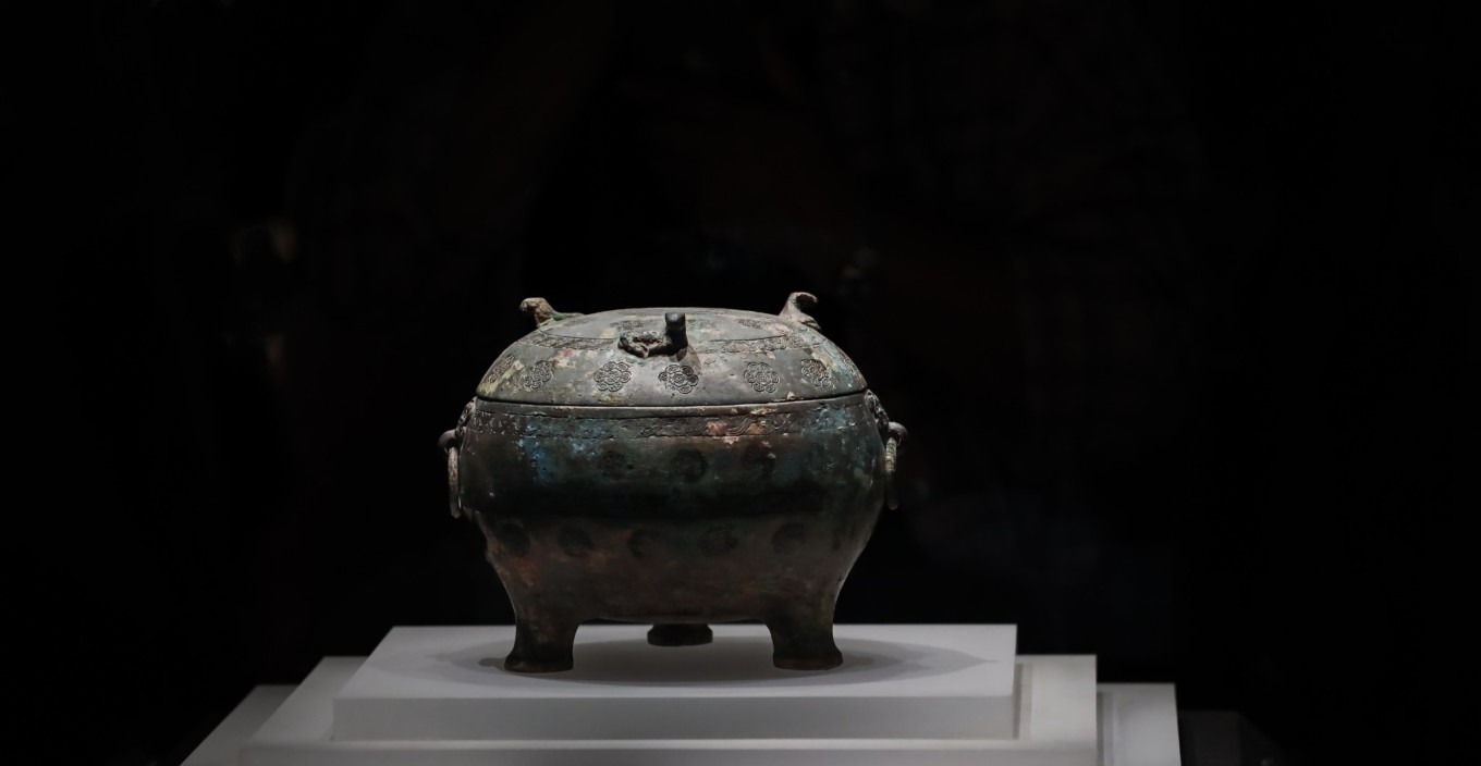 Close-up of floral pattern on bronze vessel