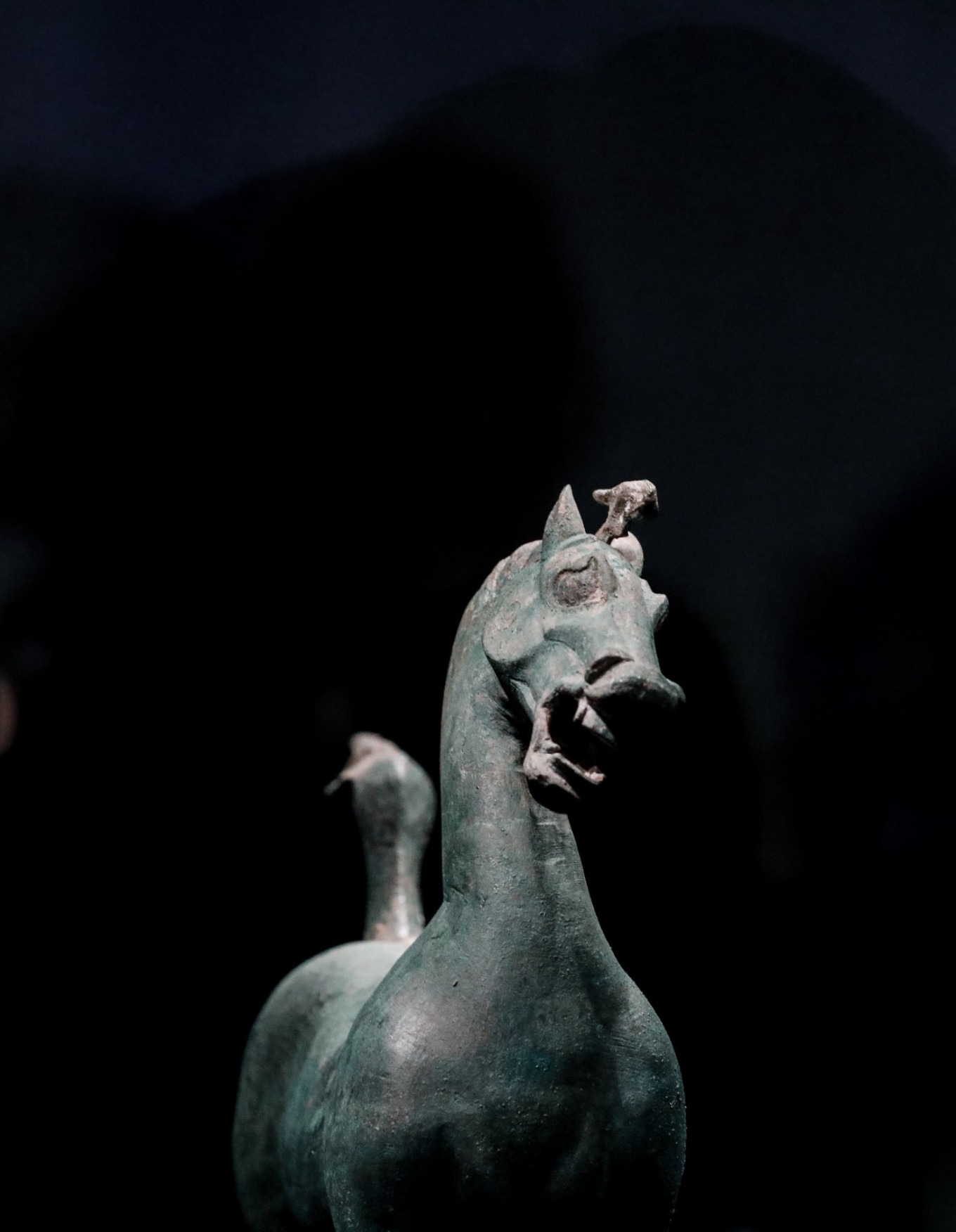 Bronze galloping horse front view